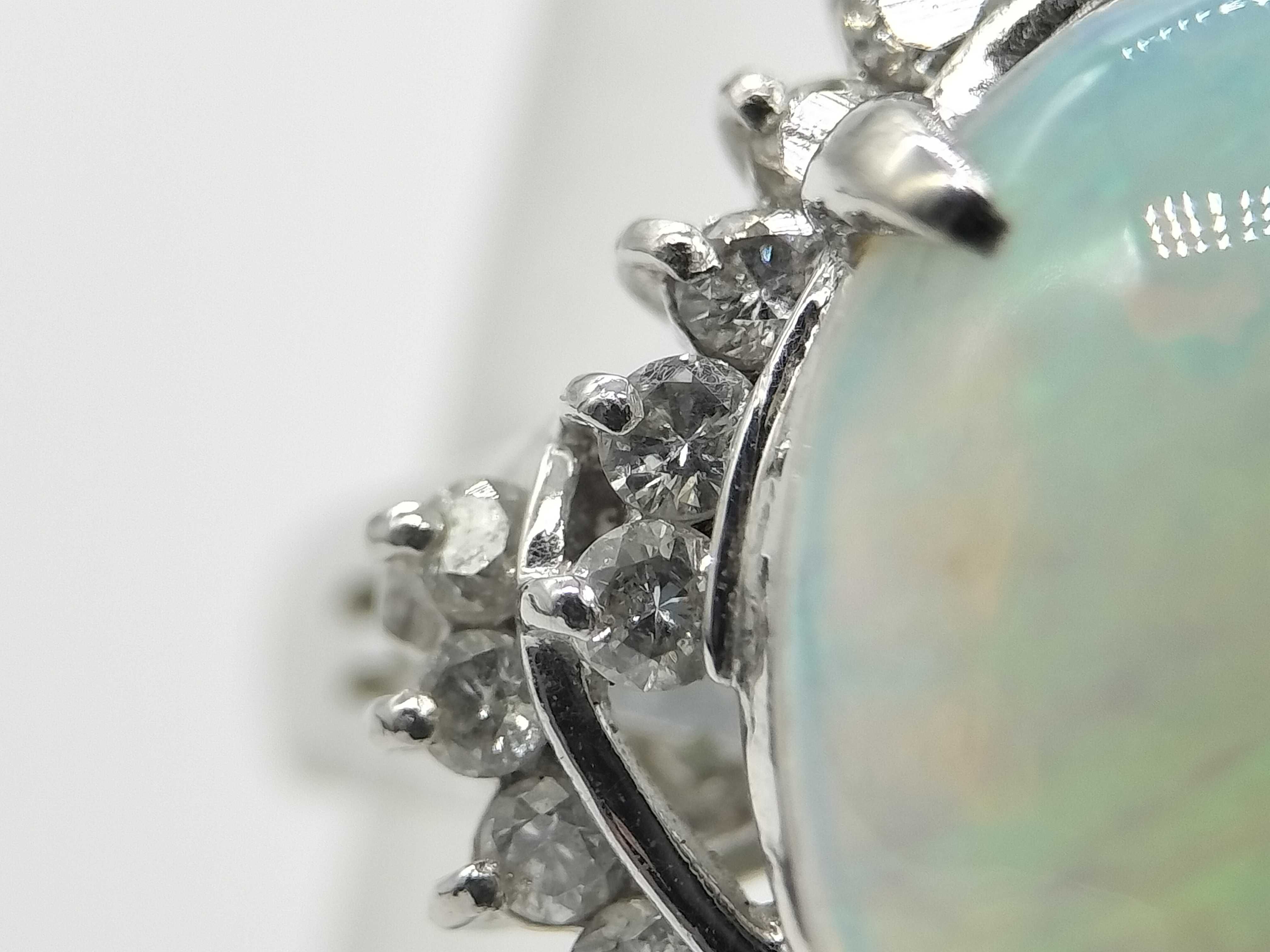 A 2.41ct Australian Opal and .50ctw Diamond Halo Cocktail Ring in Platinum