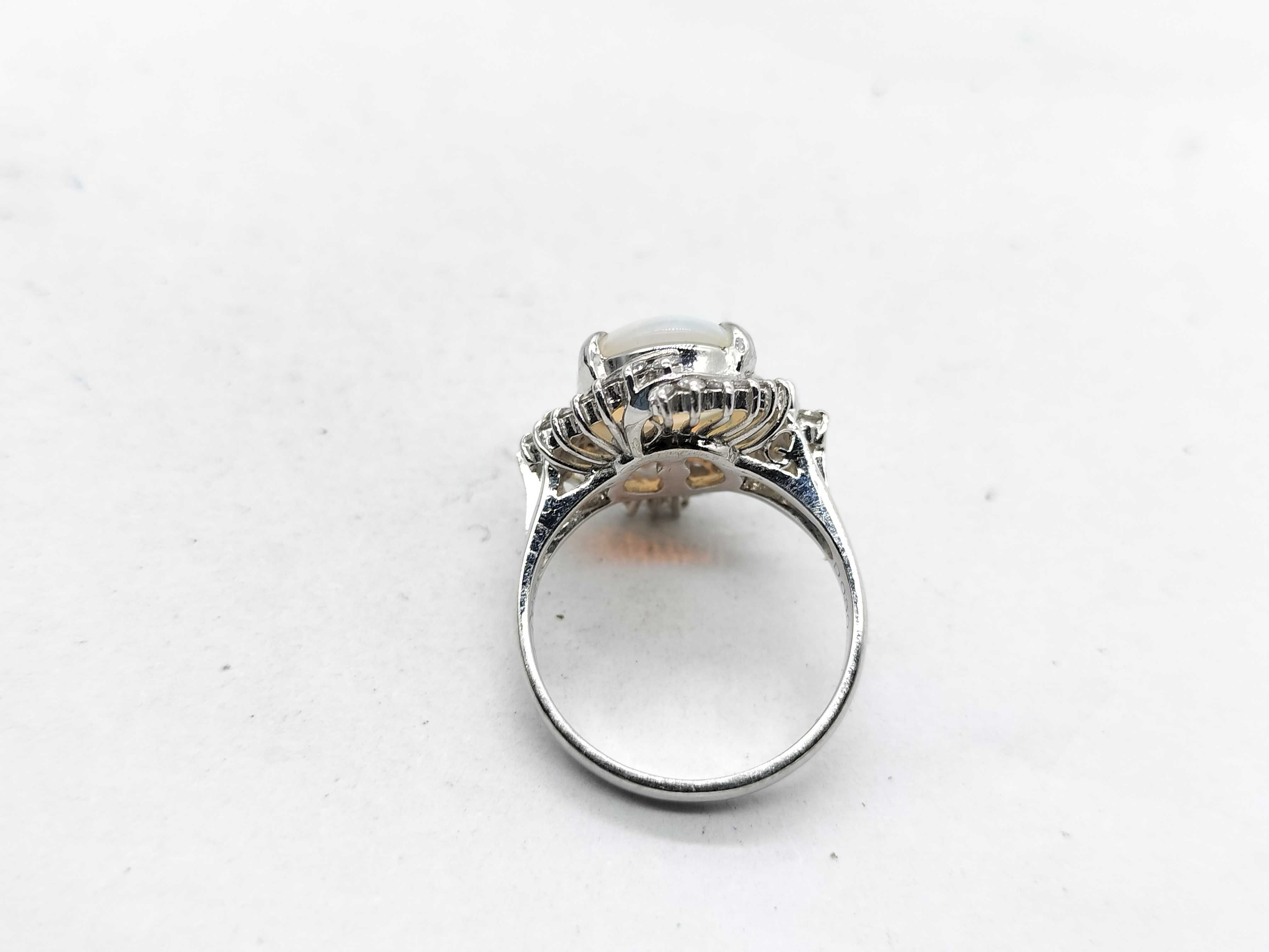 A 2.41ct Australian Opal and .50ctw Diamond Halo Cocktail Ring in Platinum
