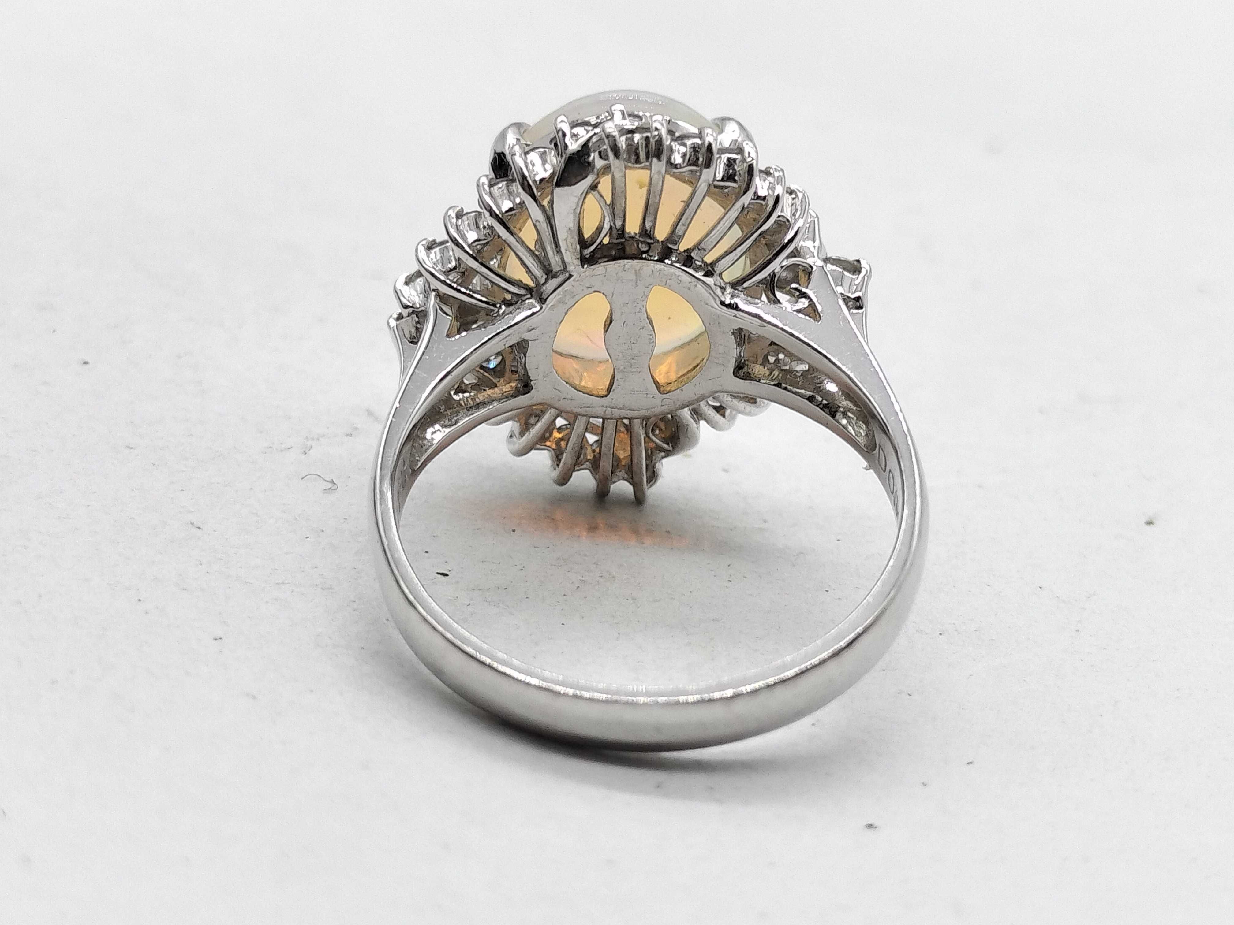 A 2.41ct Australian Opal and .50ctw Diamond Halo Cocktail Ring in Platinum