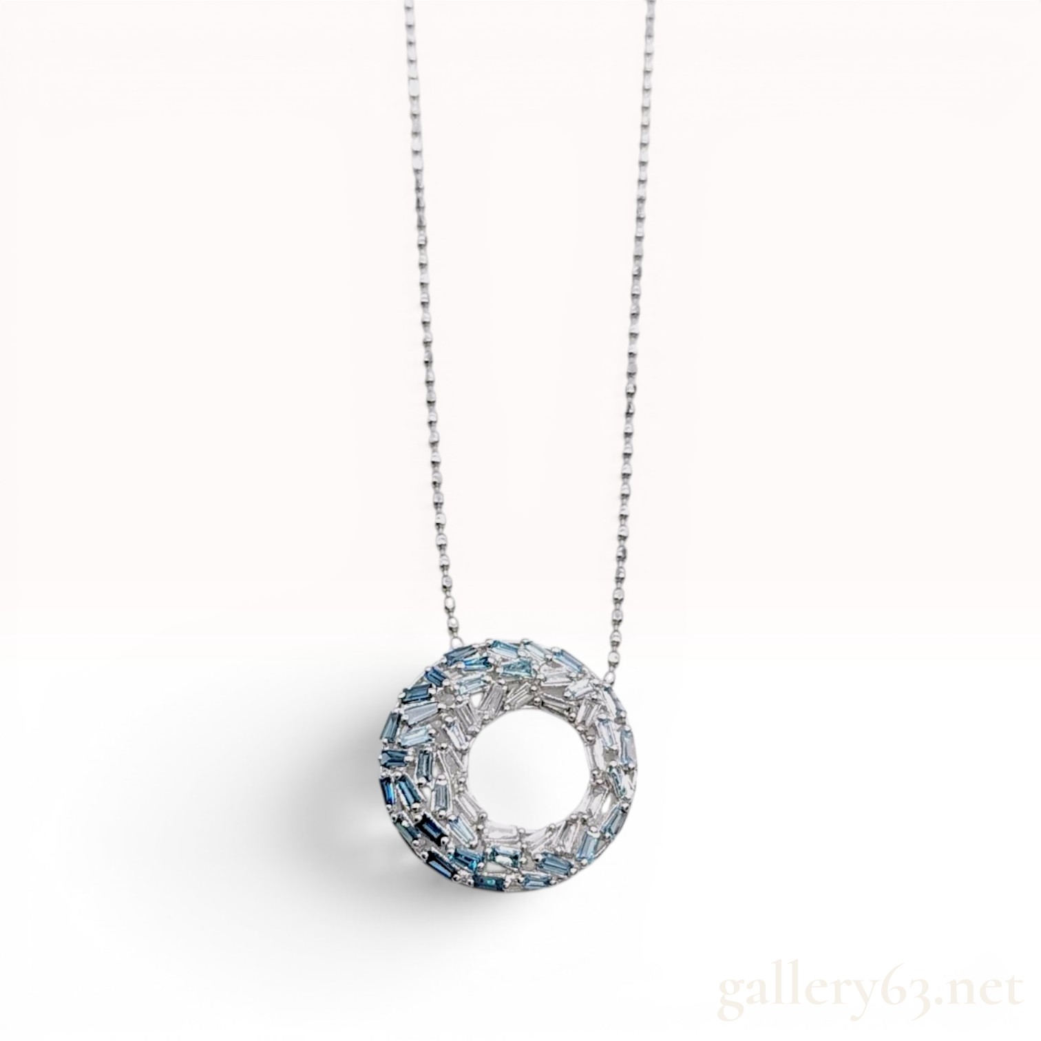 An 18 Karat White Gold 0.40 Carat Sapphire and Diamond Ombre Circle Pendant Necklace