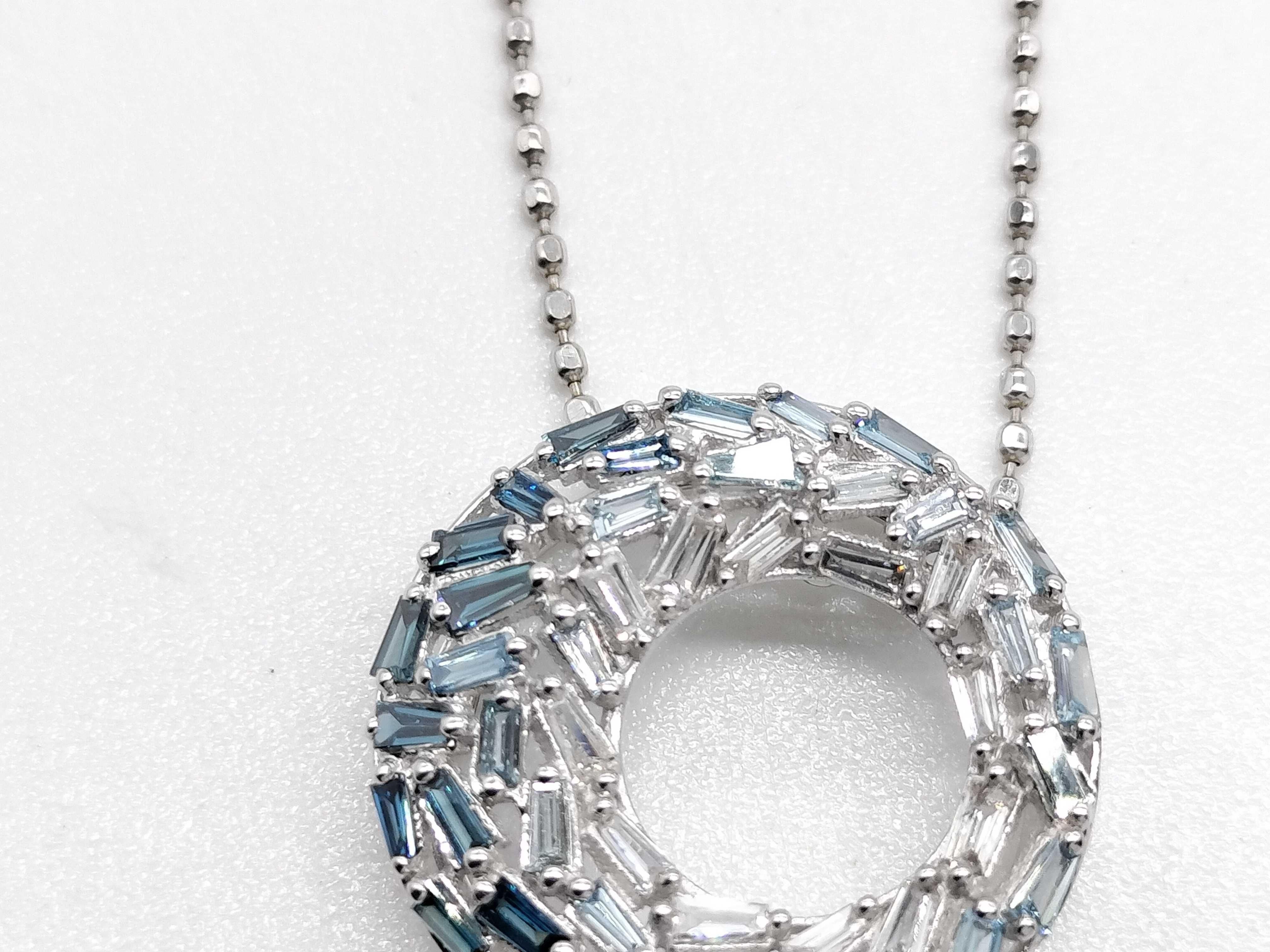 An 18 Karat White Gold 0.40 Carat Sapphire and Diamond Ombre Circle Pendant Necklace