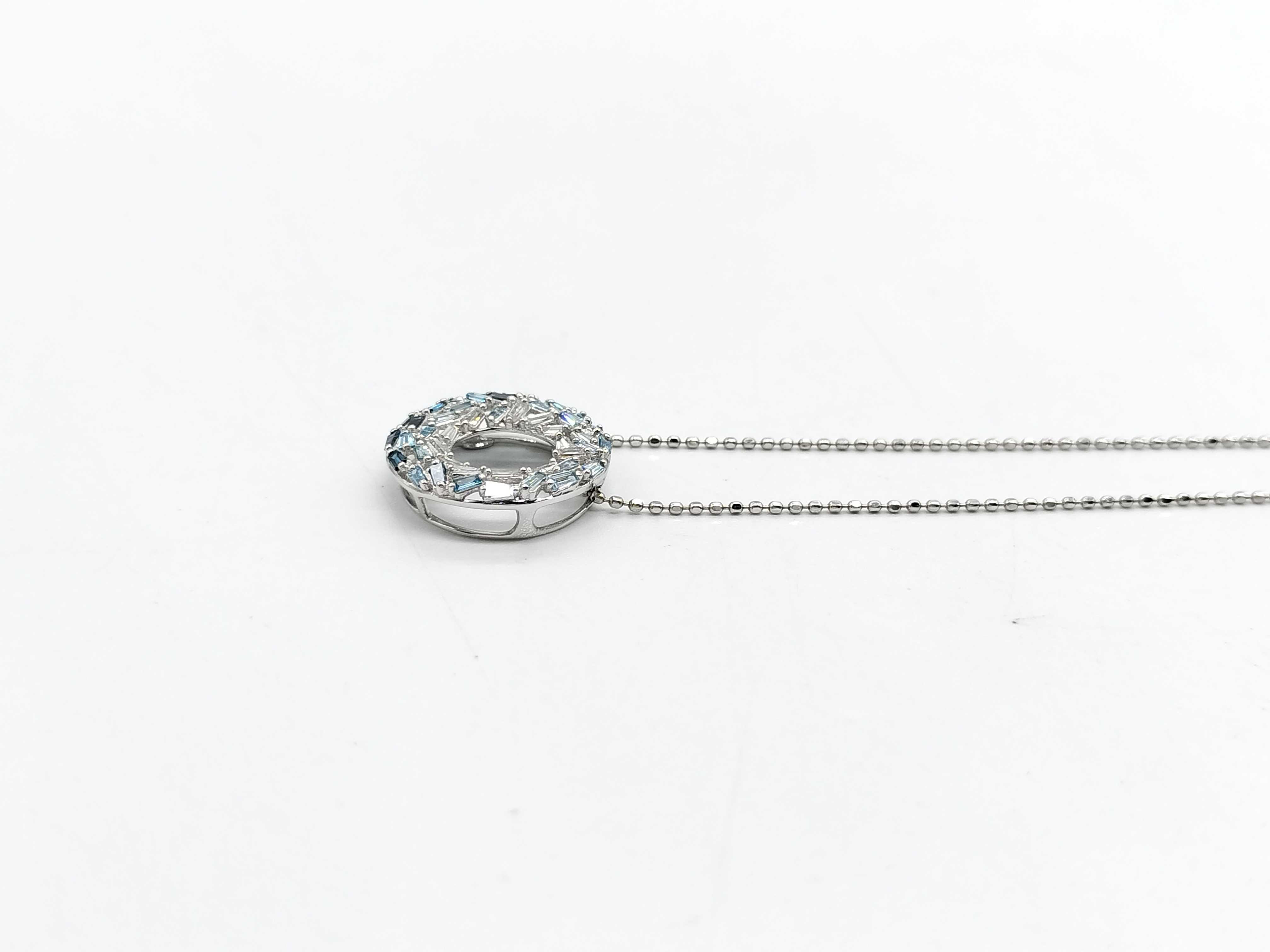 An 18 Karat White Gold 0.40 Carat Sapphire and Diamond Ombre Circle Pendant Necklace