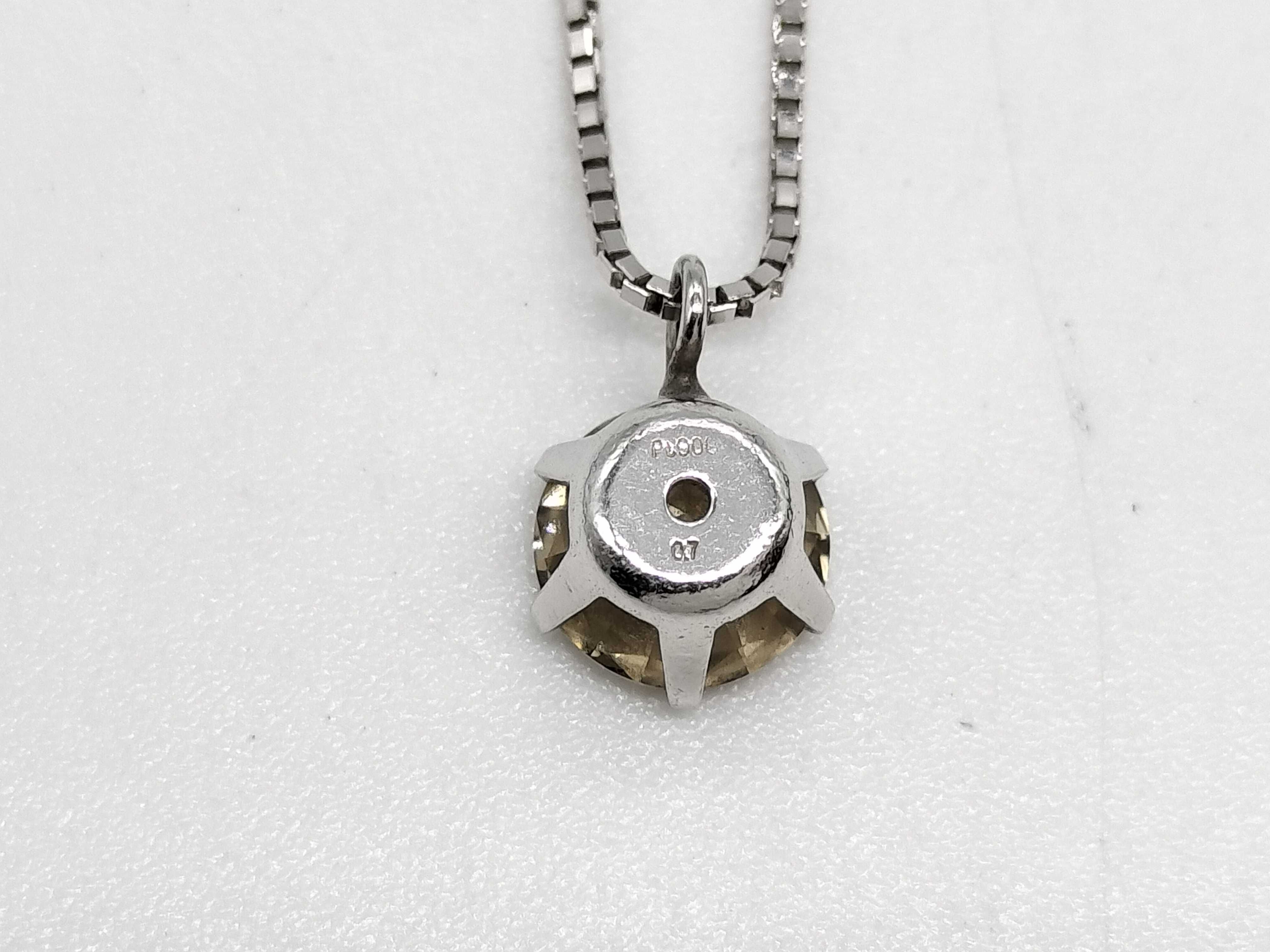 A Solitaire Diamond Pendant Necklace in Platinum and 18-Karat White Gold