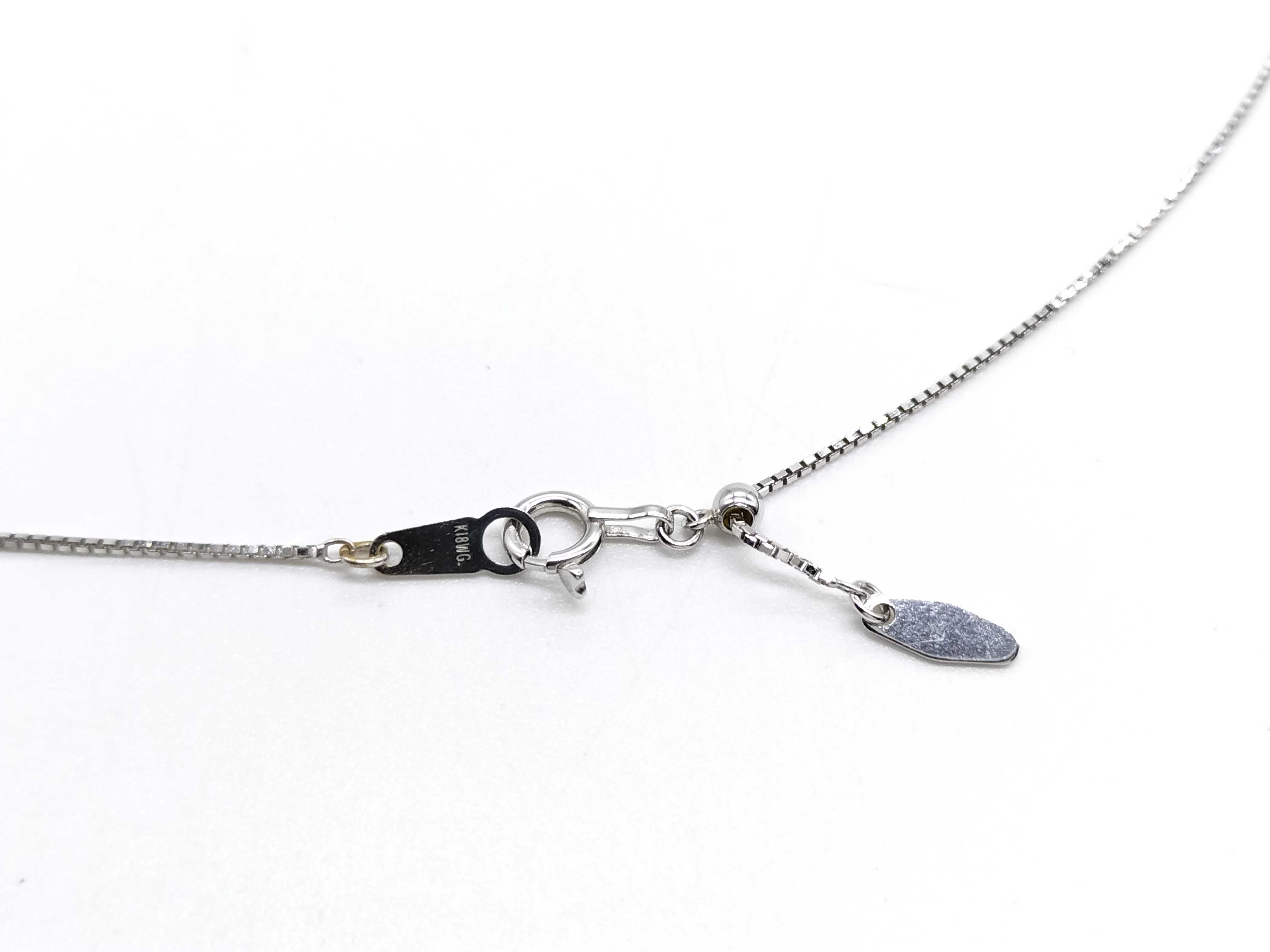 A Solitaire Diamond Pendant Necklace in Platinum and 18-Karat White Gold