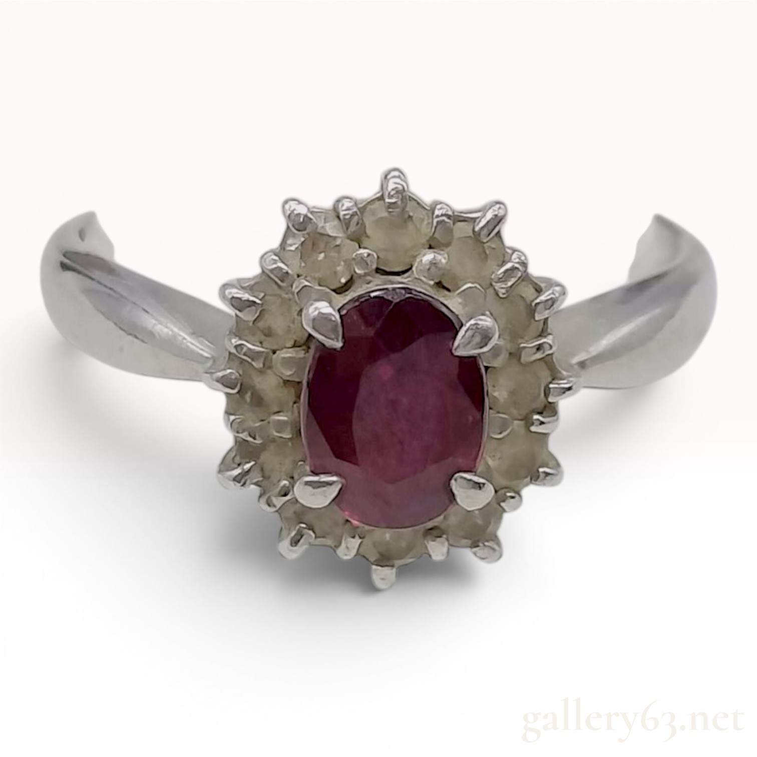 A Platinum Ruby and Diamond Halo Cluster Ring