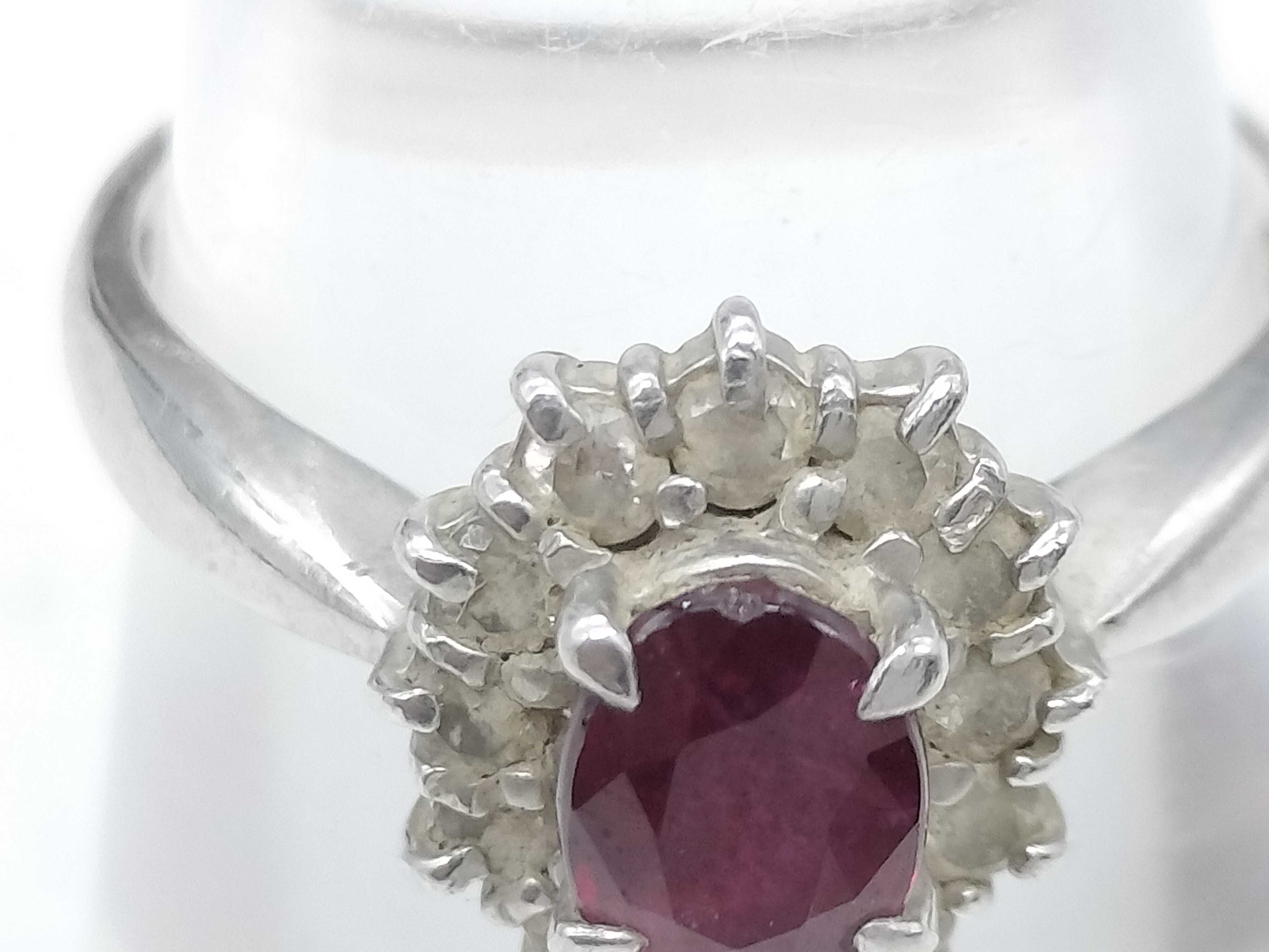 A Platinum Ruby and Diamond Halo Cluster Ring