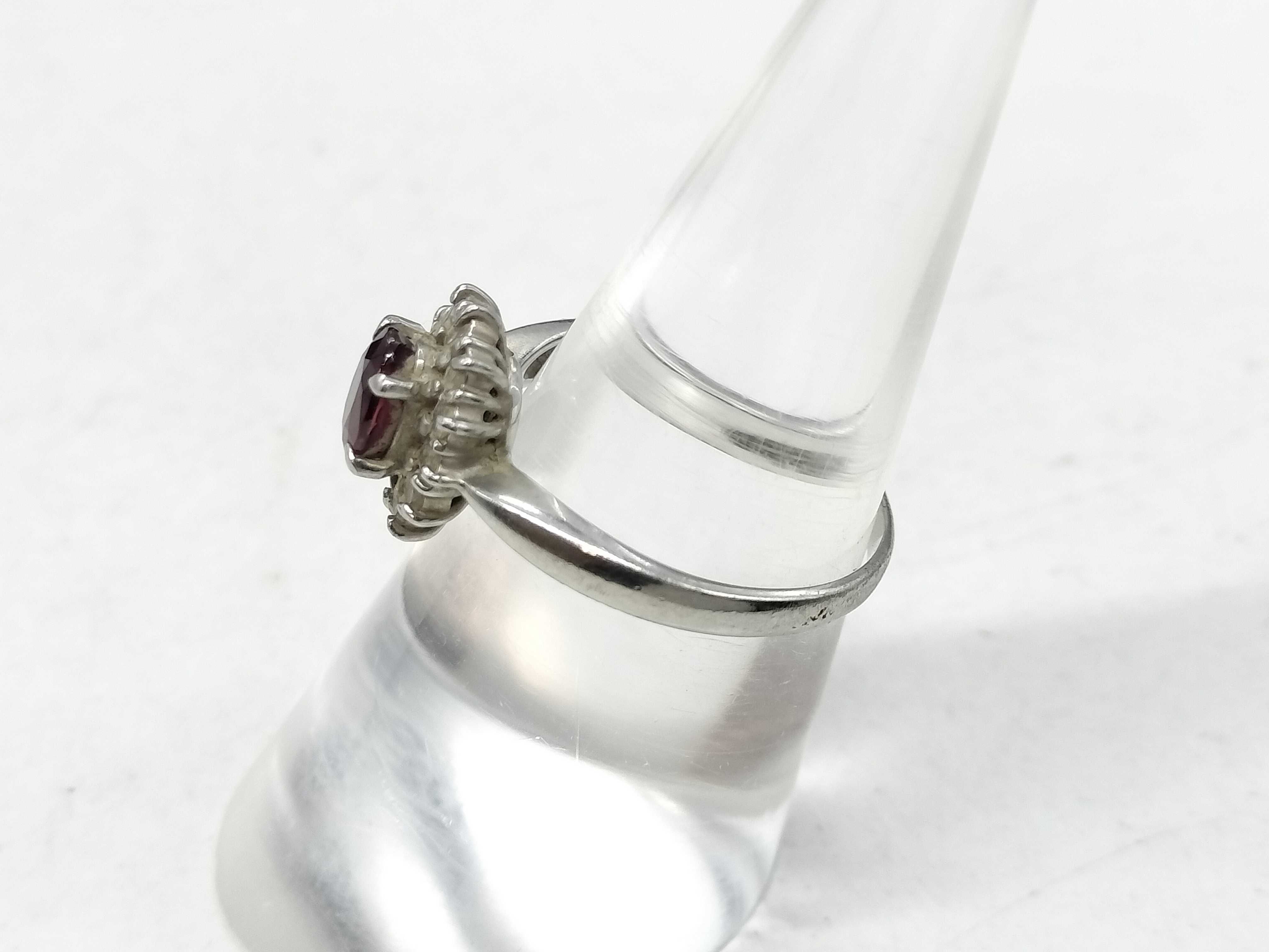 A Platinum Ruby and Diamond Halo Cluster Ring