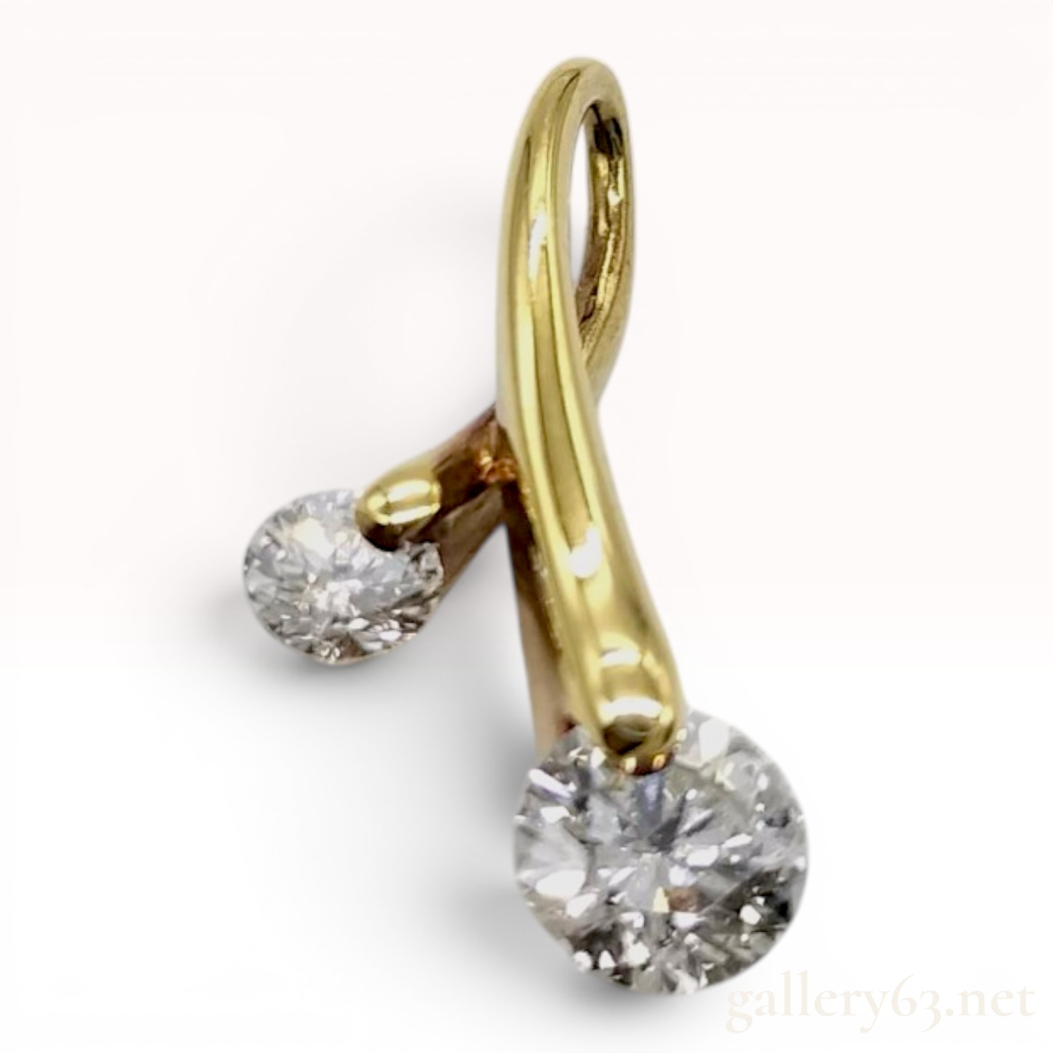 An 18 Karat Yellow Gold and Two-Stone Diamond Bypass Pendant