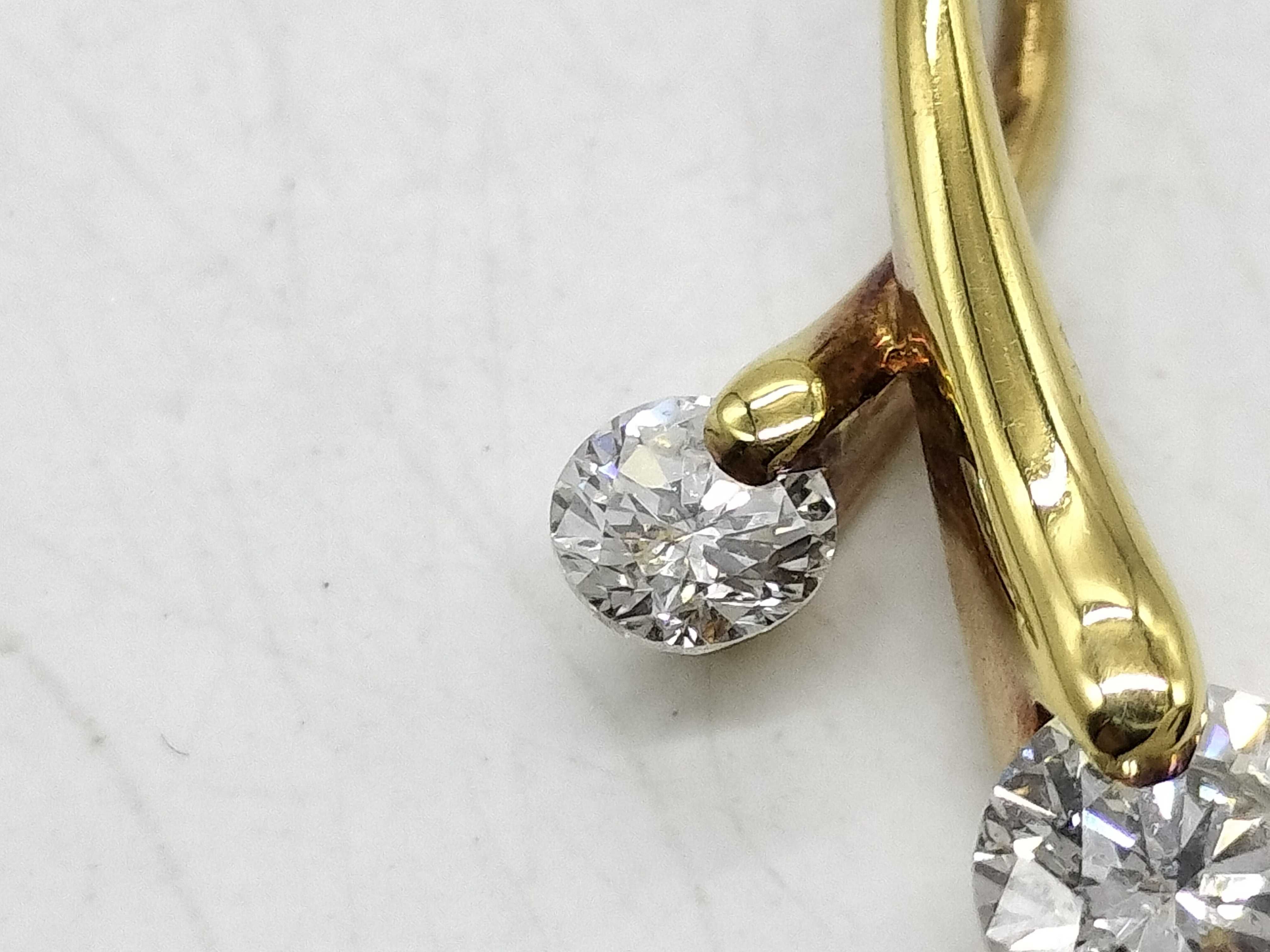 An 18 Karat Yellow Gold and Two-Stone Diamond Bypass Pendant