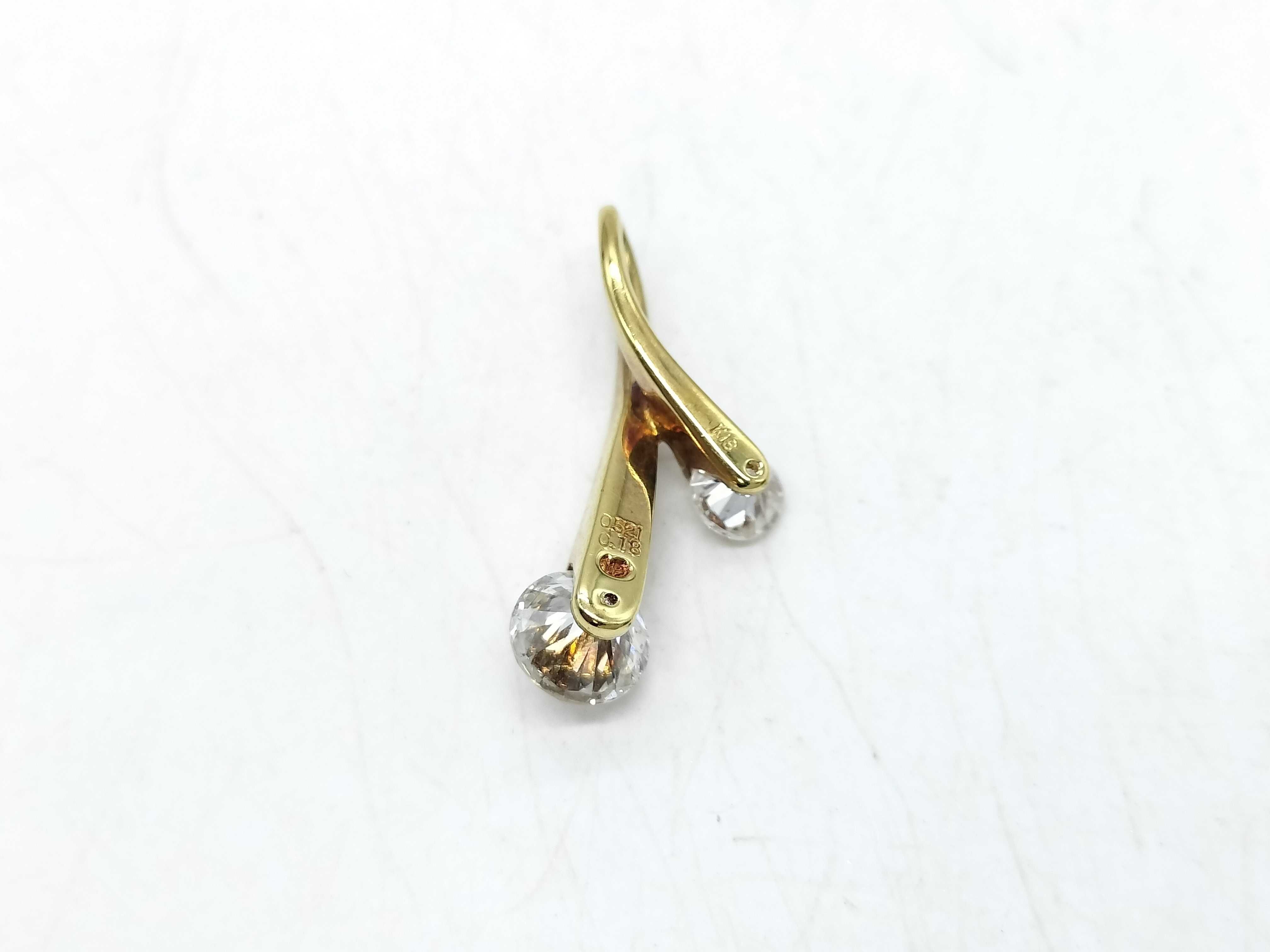 An 18 Karat Yellow Gold and Two-Stone Diamond Bypass Pendant