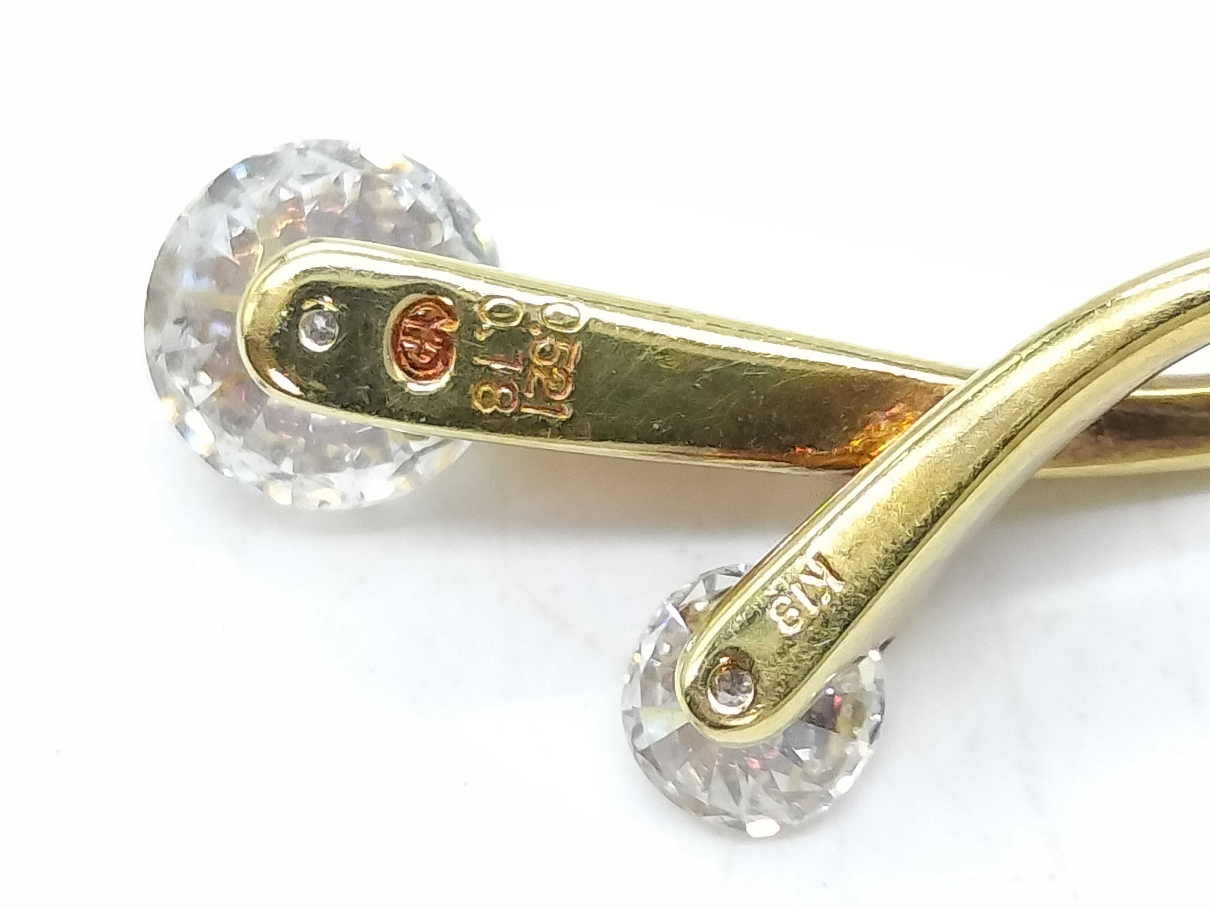An 18 Karat Yellow Gold and Two-Stone Diamond Bypass Pendant