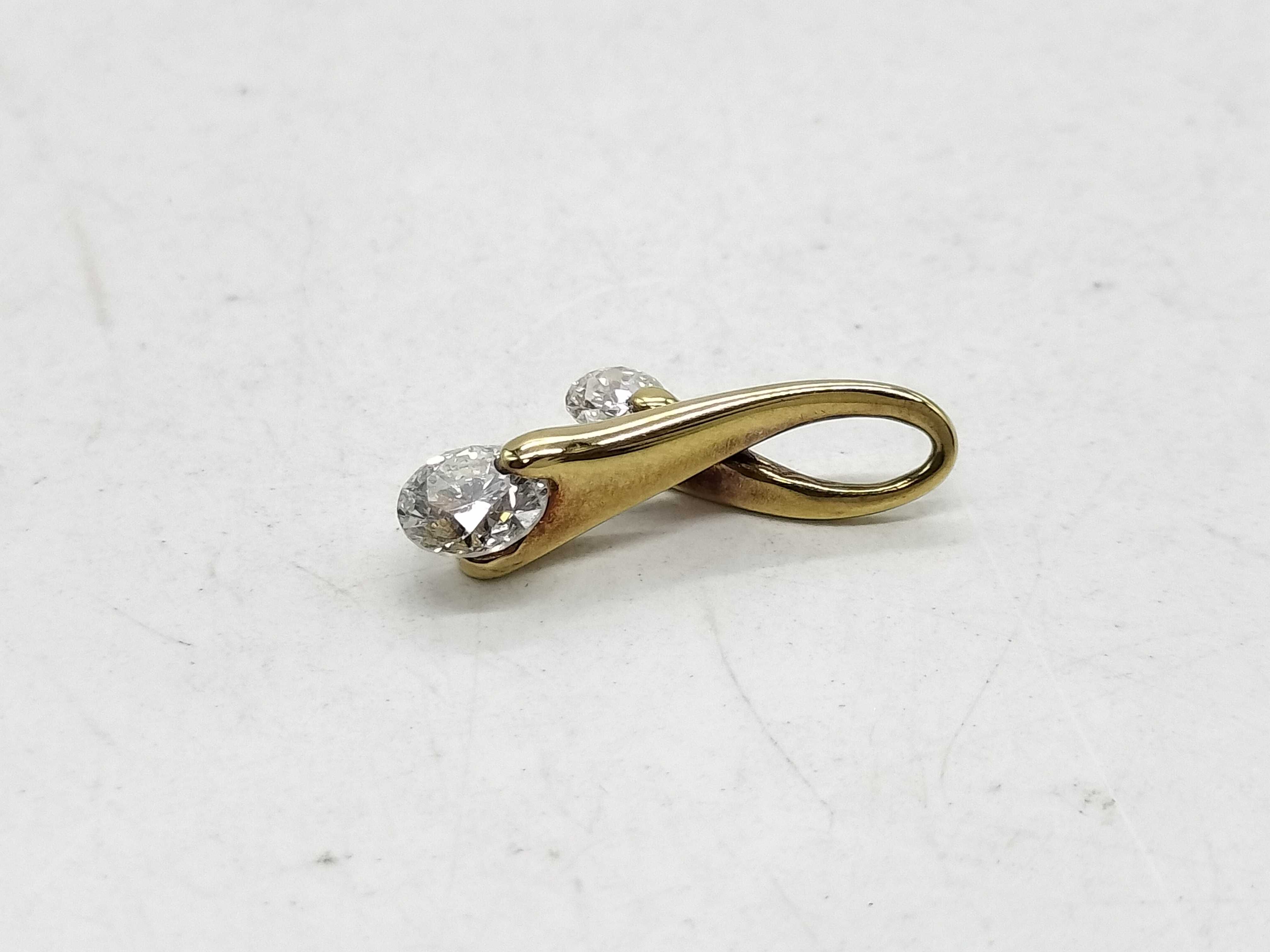 An 18 Karat Yellow Gold and Two-Stone Diamond Bypass Pendant