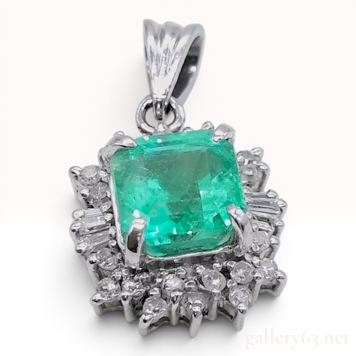 Platinum 1.22ct Emerald and .20ctw Diamond Halo Pendant