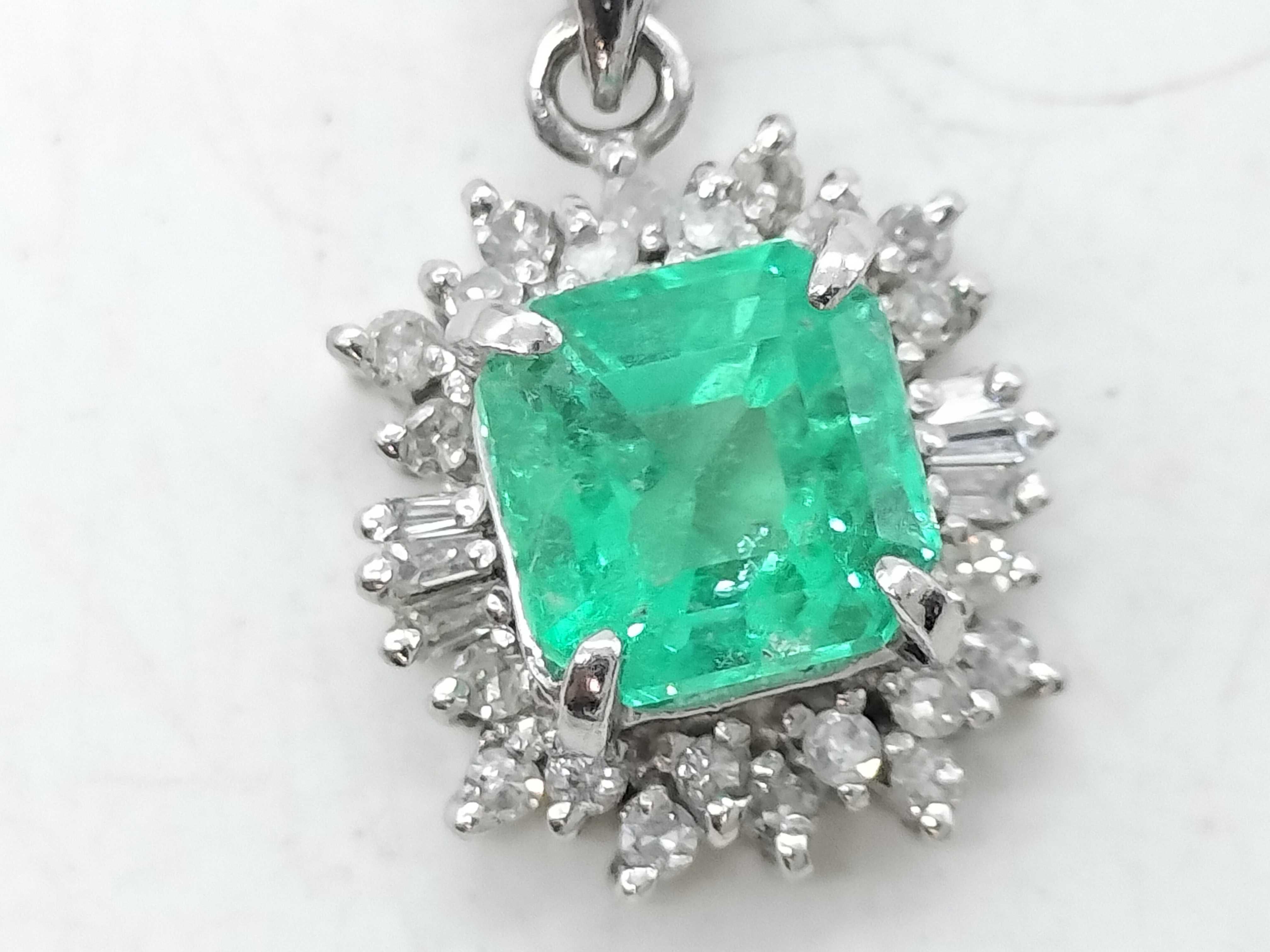 Platinum 1.22ct Emerald and .20ctw Diamond Halo Pendant