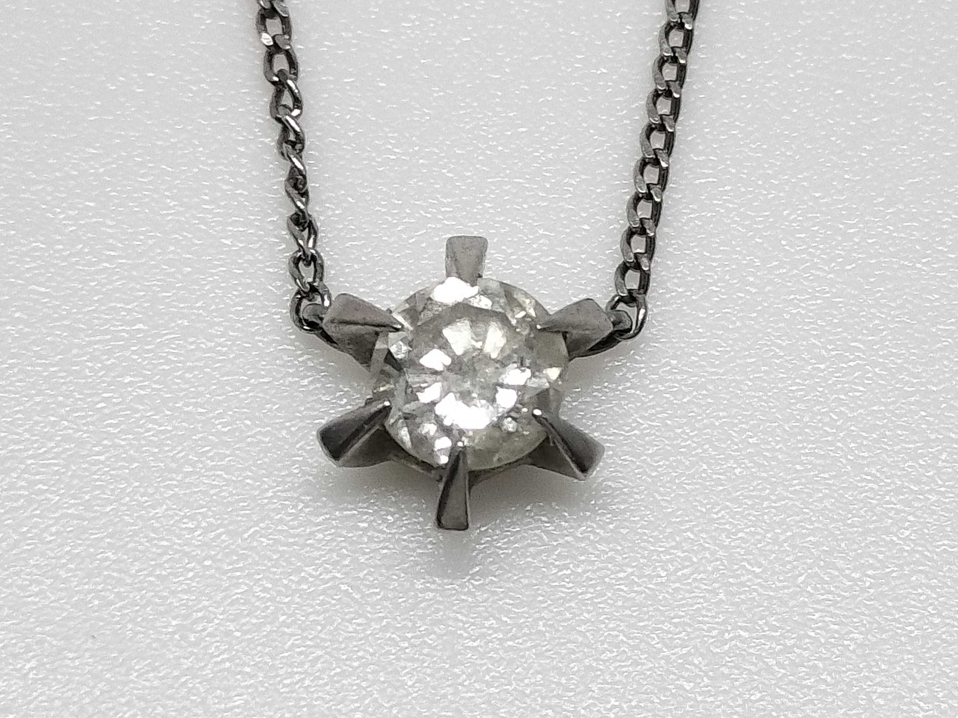 A Platinum and 0.41 Carat Diamond Solitaire Pendant Necklace