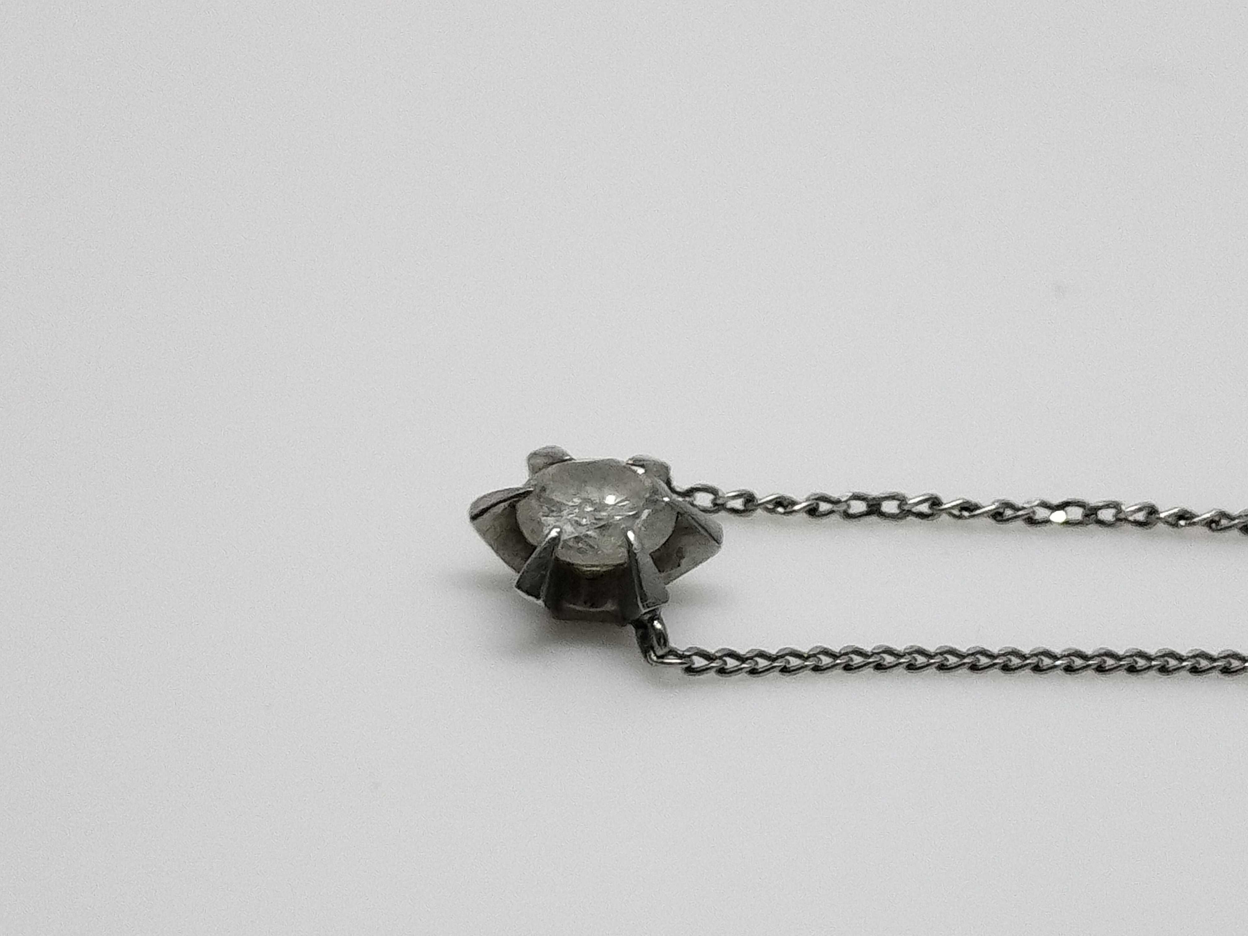 A Platinum and 0.41 Carat Diamond Solitaire Pendant Necklace