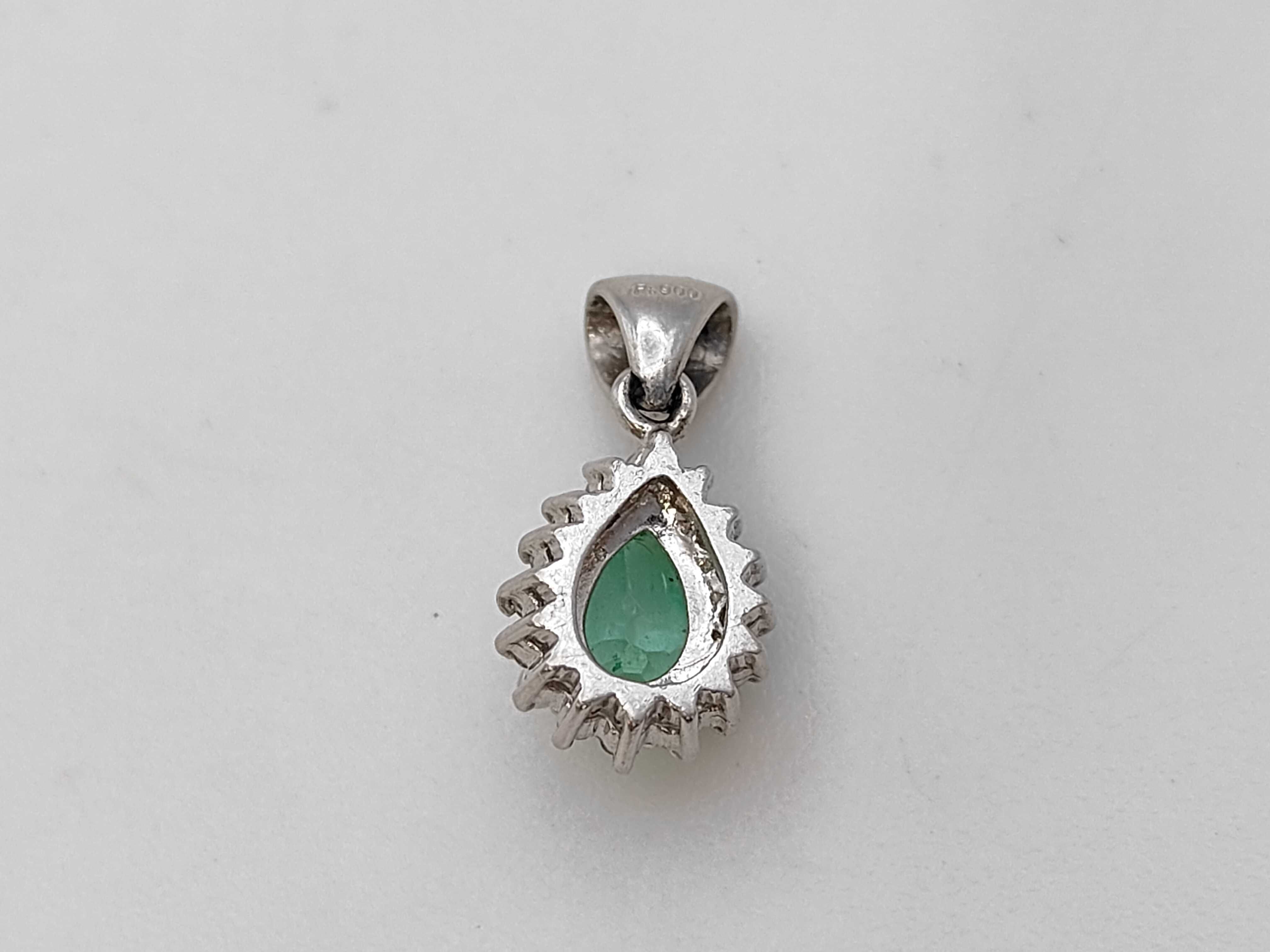 A Platinum Pear-Cut Emerald and Diamond Halo Pendant