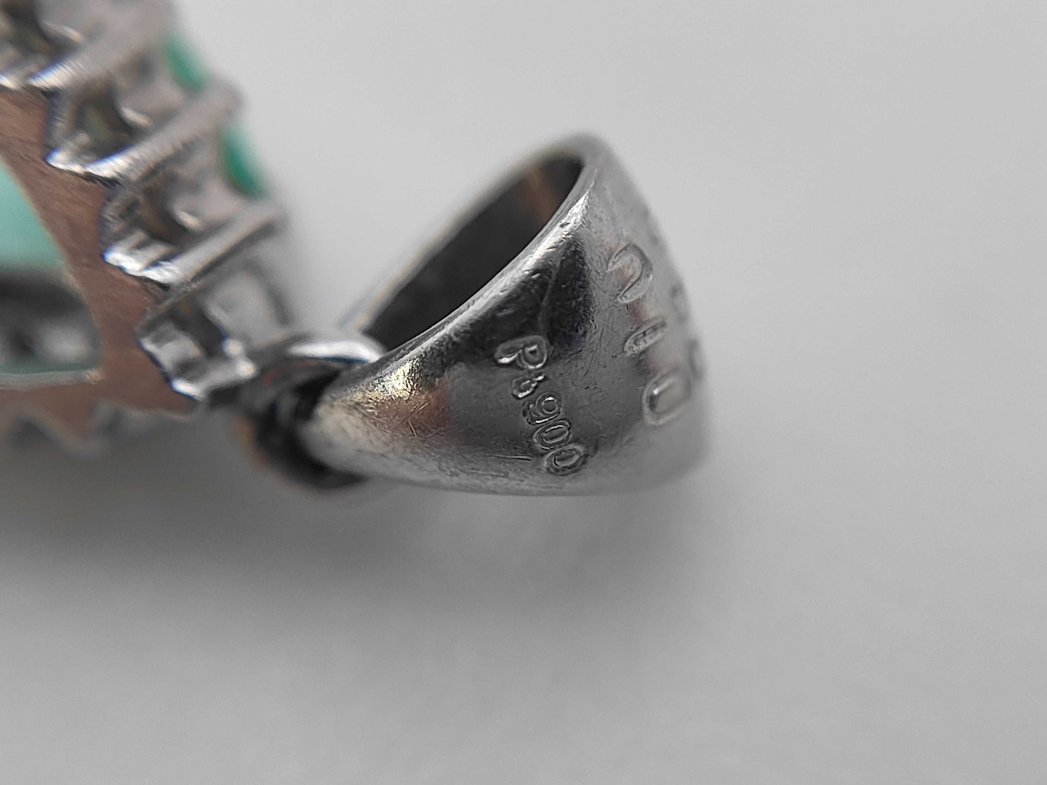 A Platinum Pear-Cut Emerald and Diamond Halo Pendant