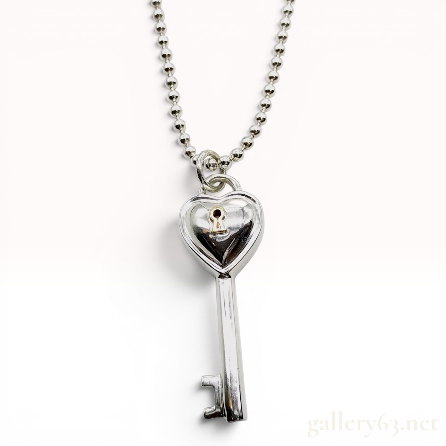 Tiffany & Co. Sterling Silver and 18 Karat Yellow Gold Heart Key Pendant Necklace