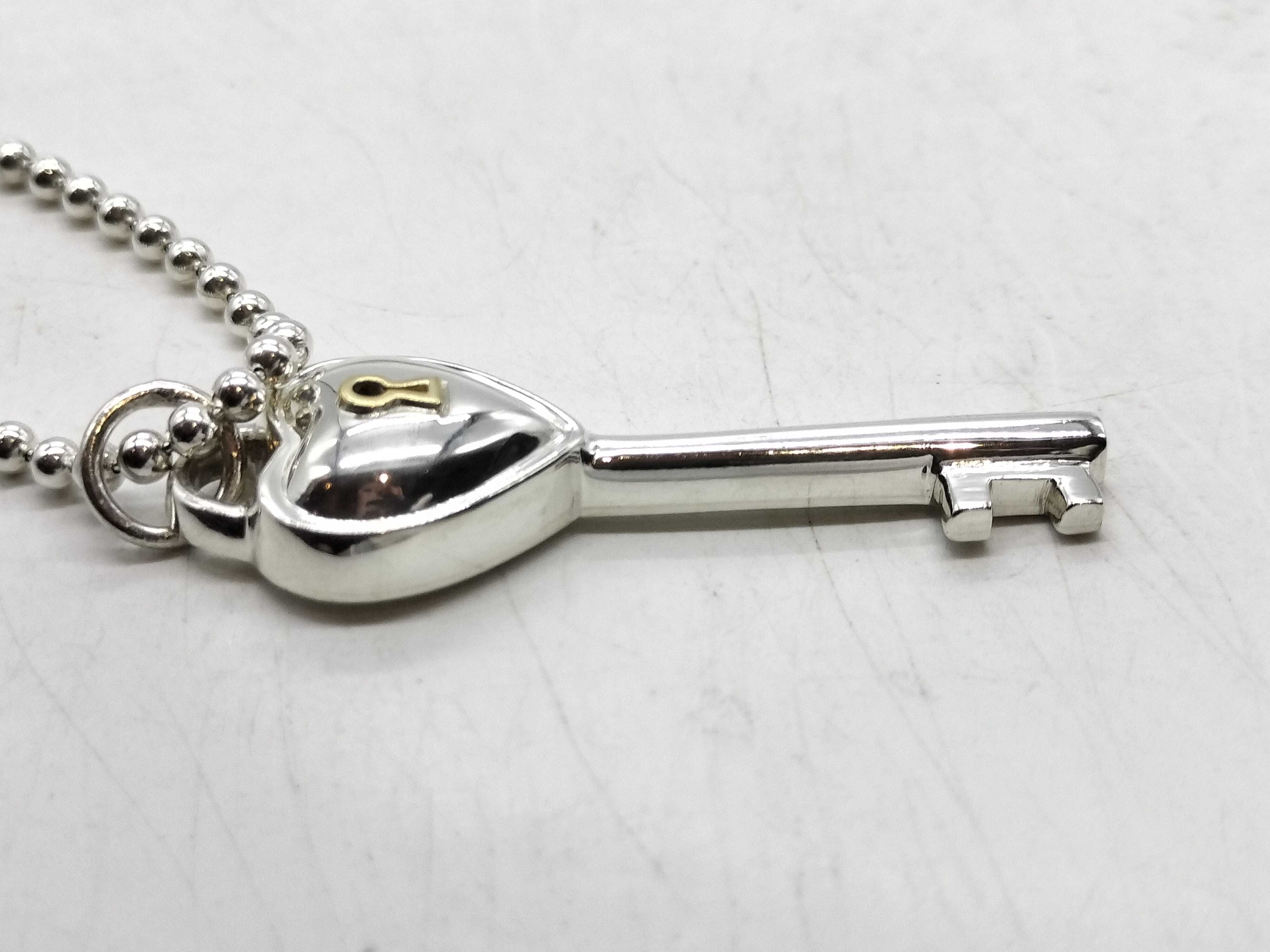 Tiffany & Co. Sterling Silver and 18 Karat Yellow Gold Heart Key Pendant Necklace
