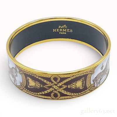 Hermes Grand Apparat Wide Enamel Bangle. An Hermes wide enamel bangle featuring the Grand 