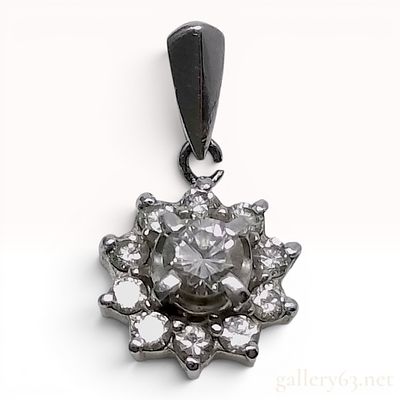 18 Karat White Gold .40ct Diamond Halo Cluster Pendant. This 18 karat white gold pendant 