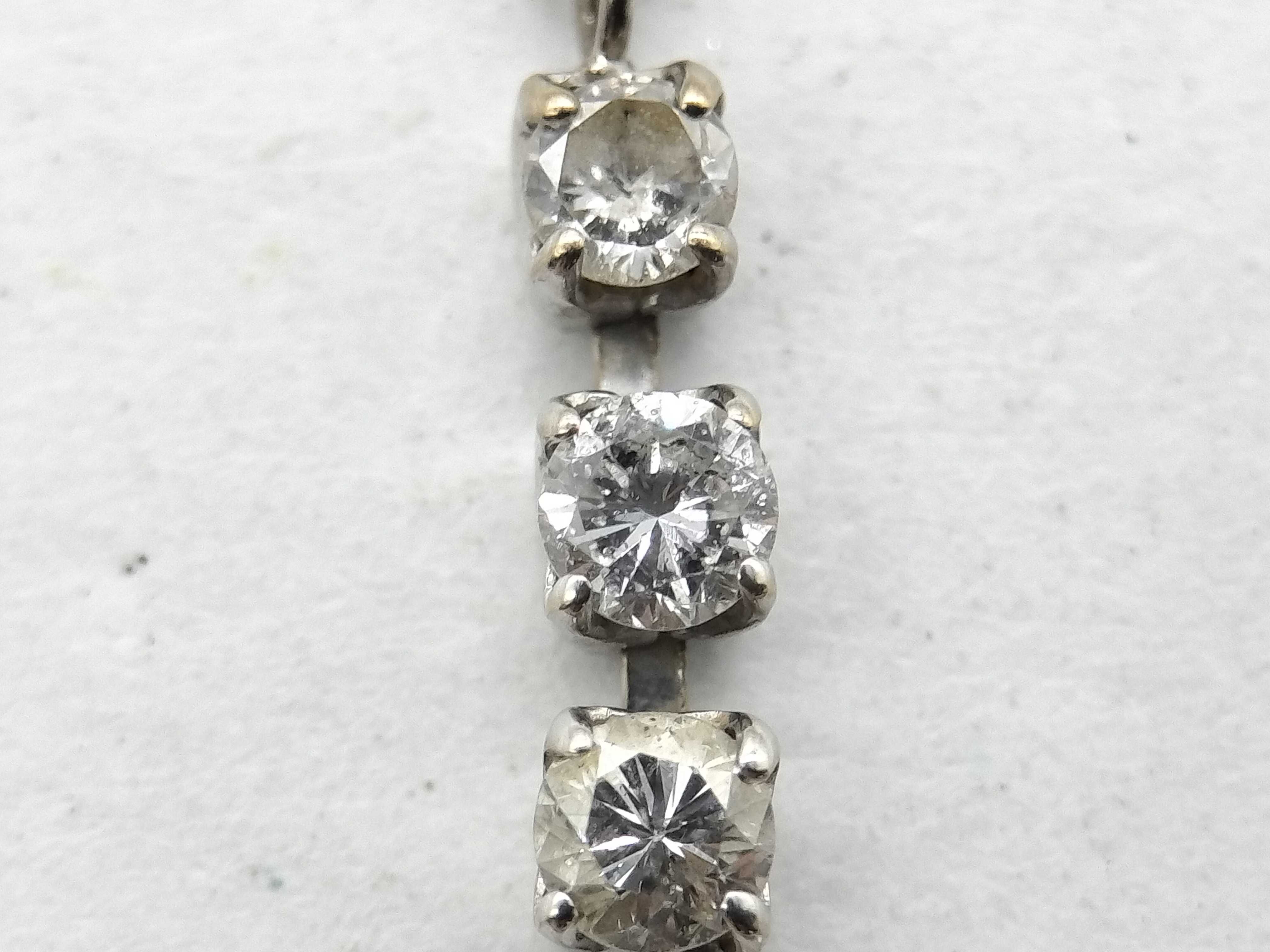 An 18 Karat White Gold and Diamond Three Stone Drop Necklace