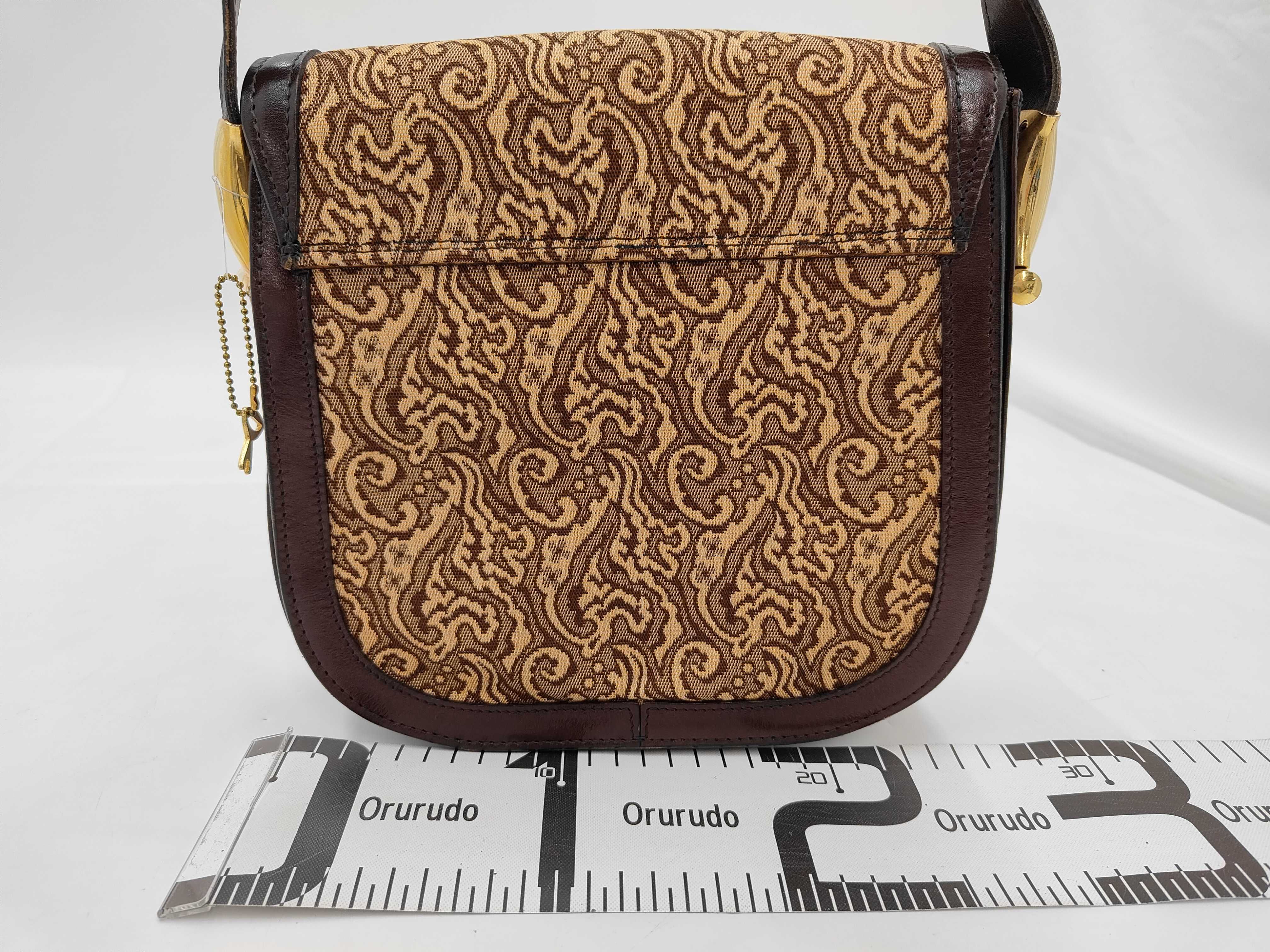 A Vintage Les Must de Cartier Bordeaux Leather and Tapestry Shoulder Bag