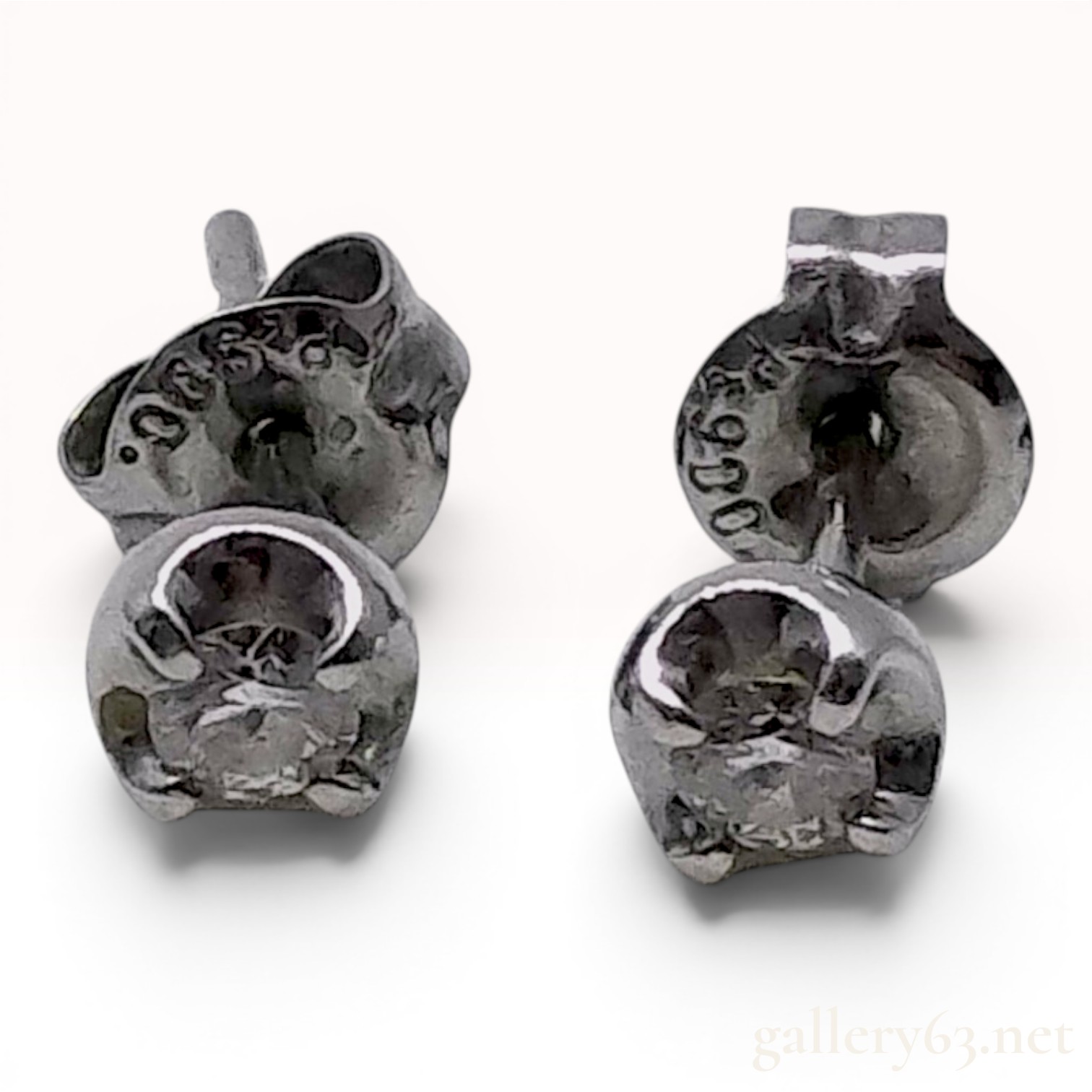 A Pair of Platinum and Round-Cut Diamond Stud Earrings