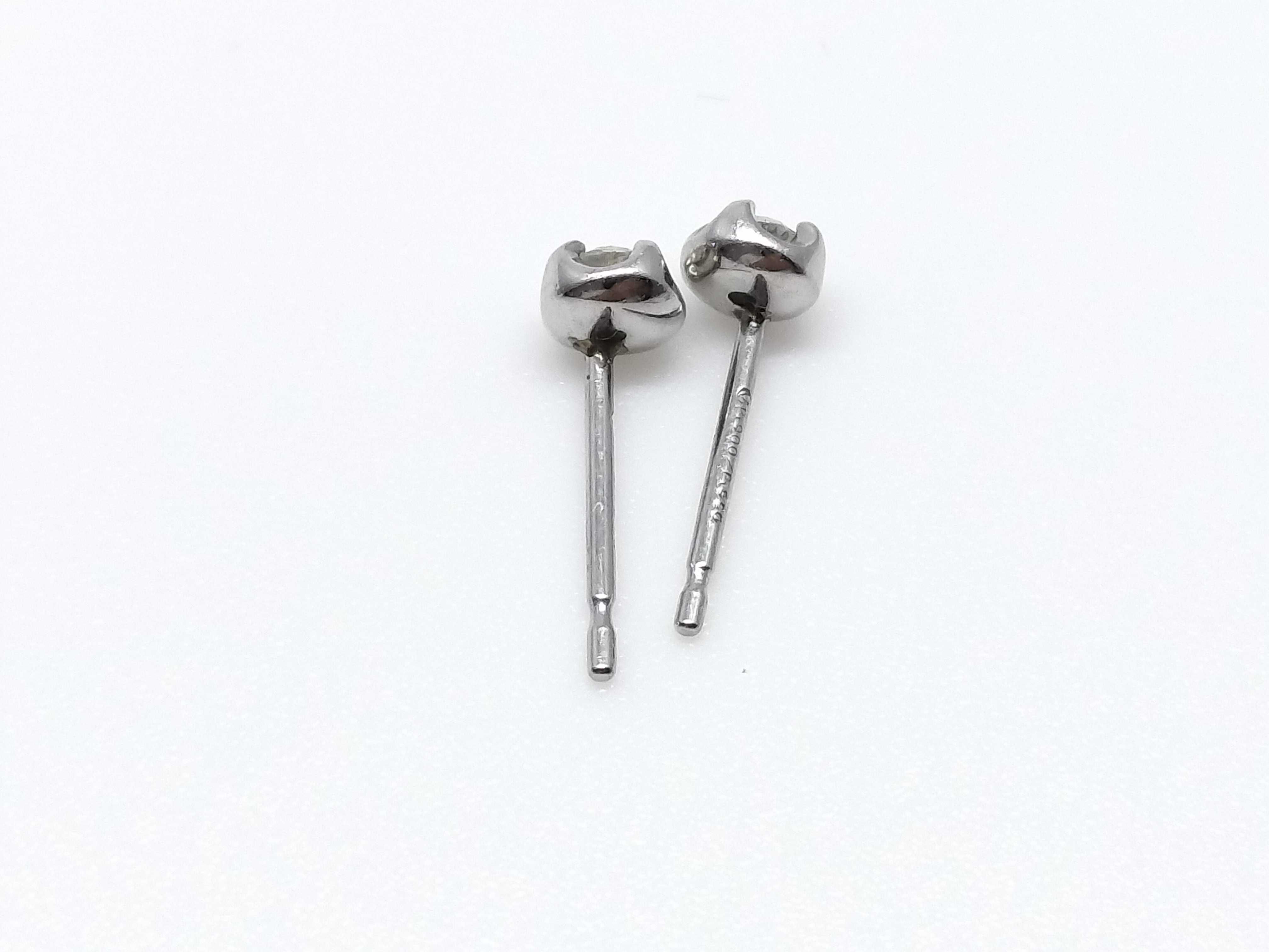 A Pair of Platinum and Round-Cut Diamond Stud Earrings