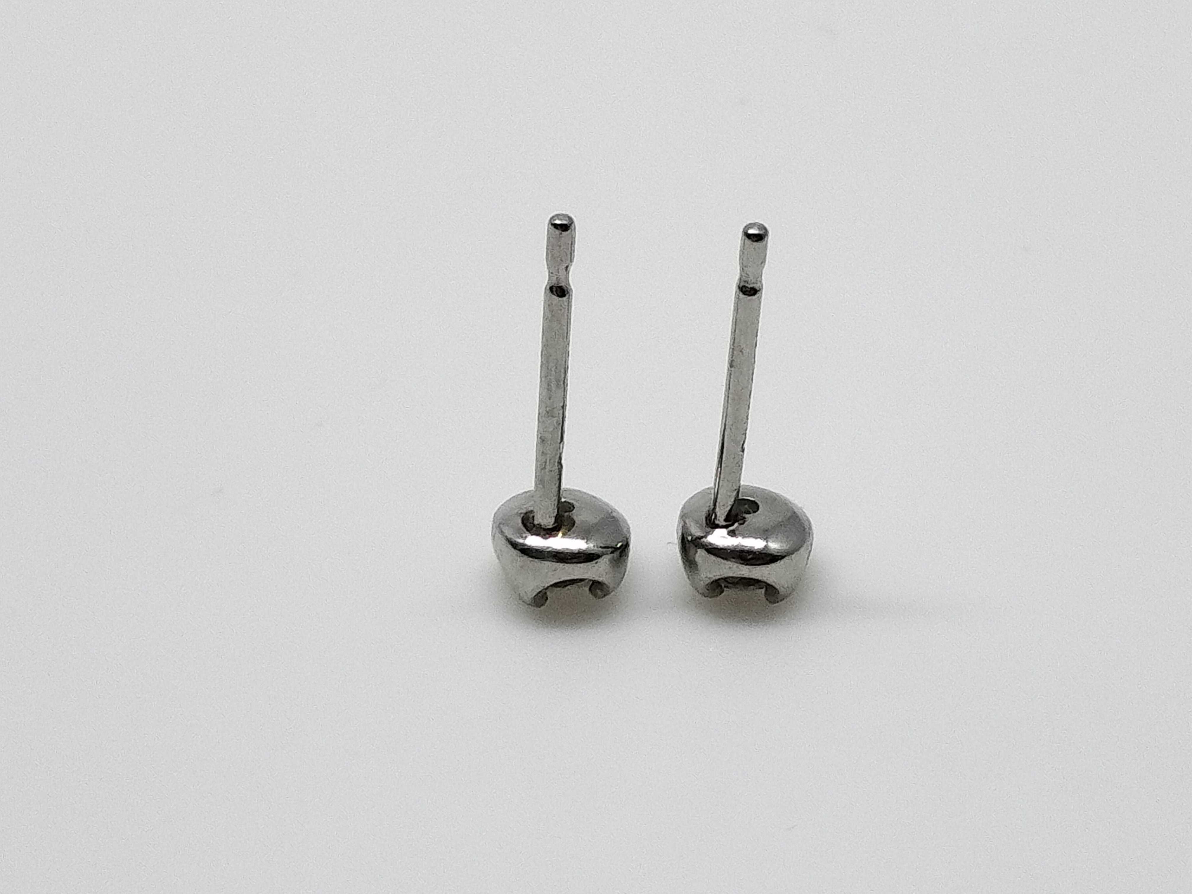 A Pair of Platinum and Round-Cut Diamond Stud Earrings