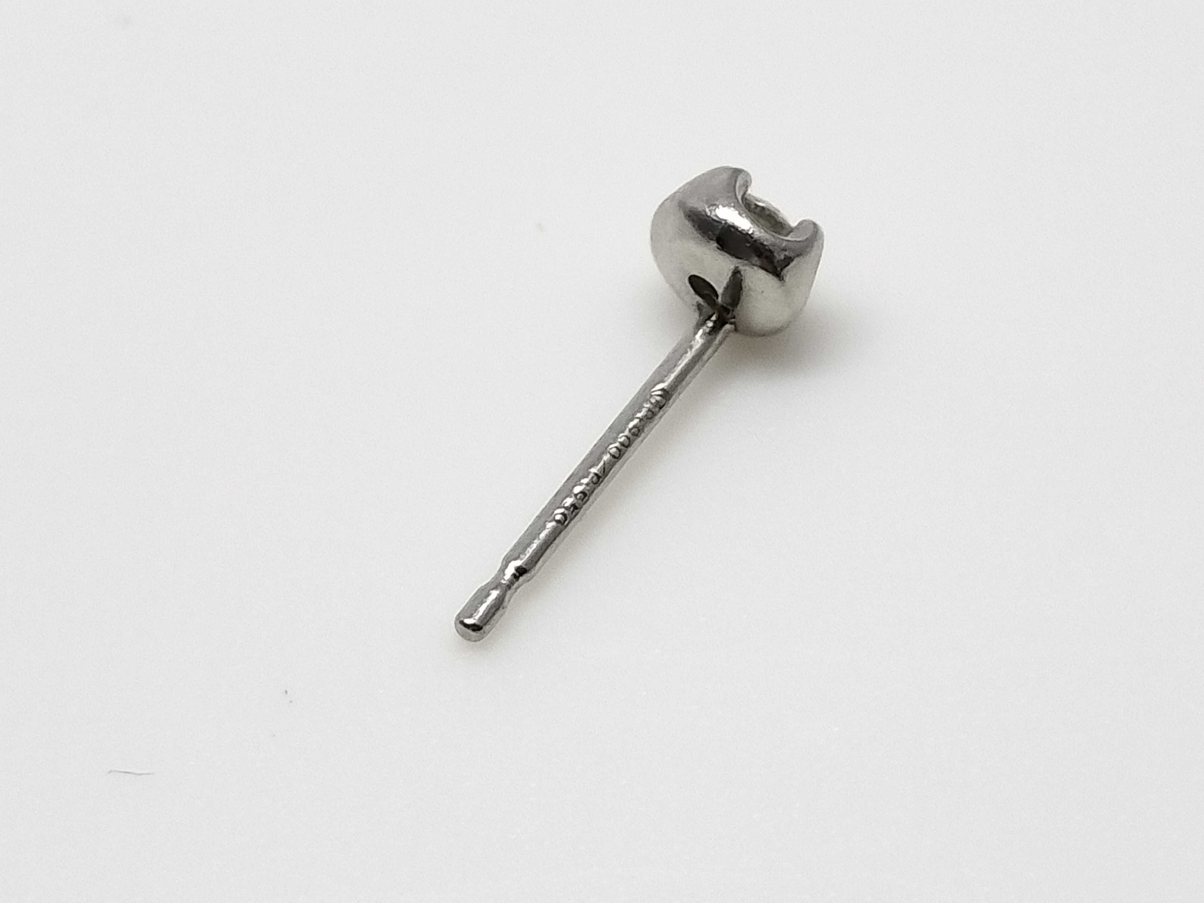 A Pair of Platinum and Round-Cut Diamond Stud Earrings