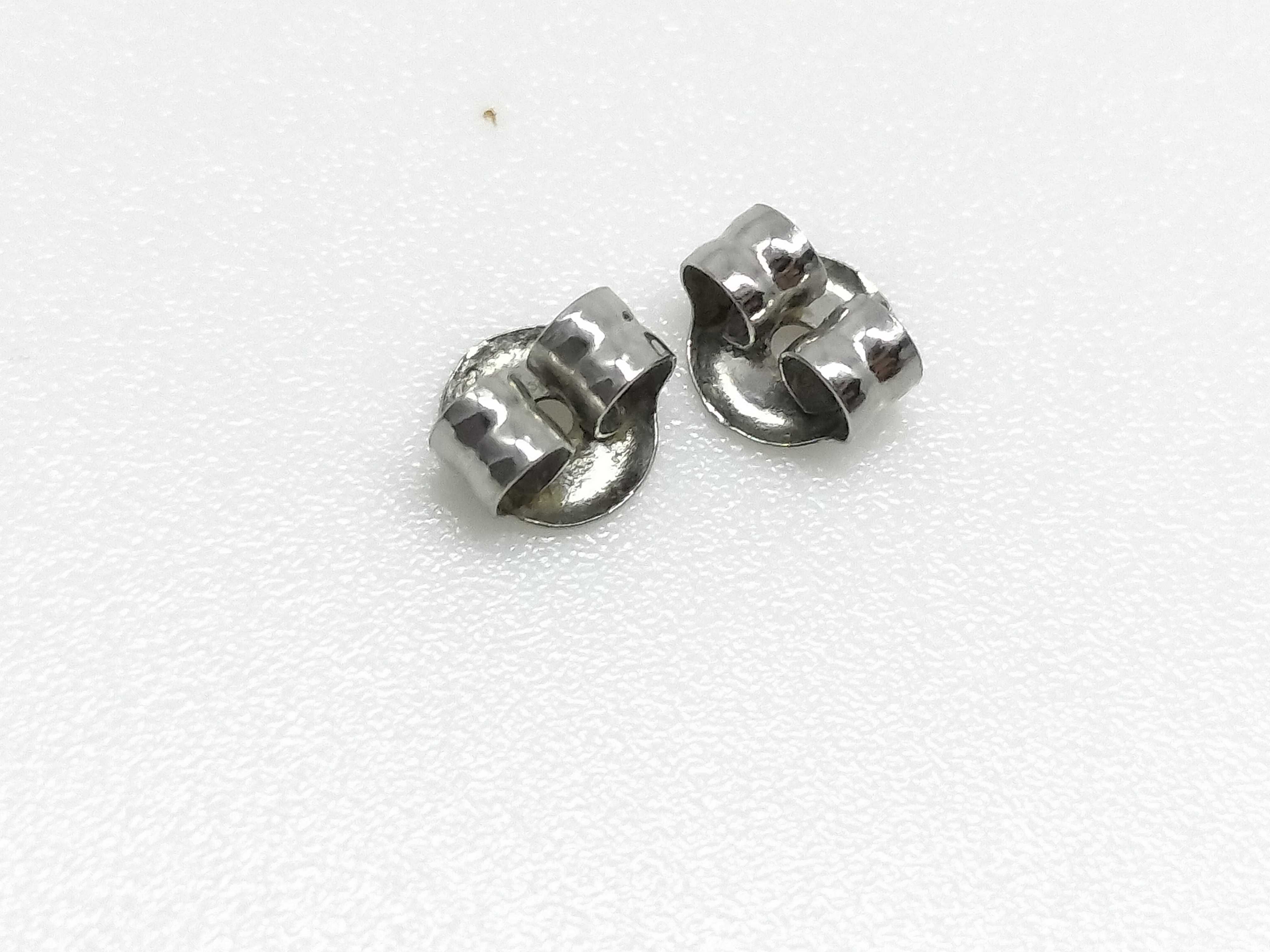 A Pair of Platinum and Round-Cut Diamond Stud Earrings