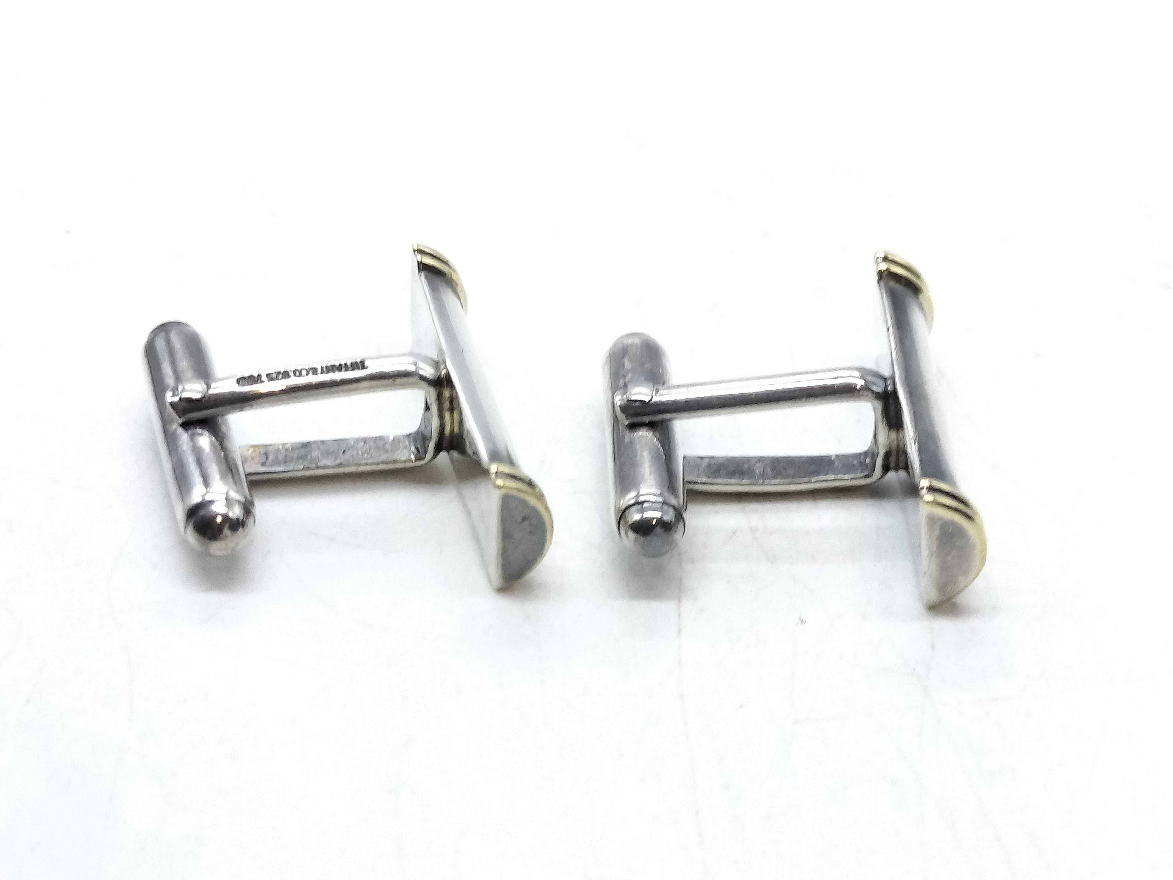 A Pair of Tiffany & Co. Sterling Silver and 18K Yellow Gold Baton Cufflinks