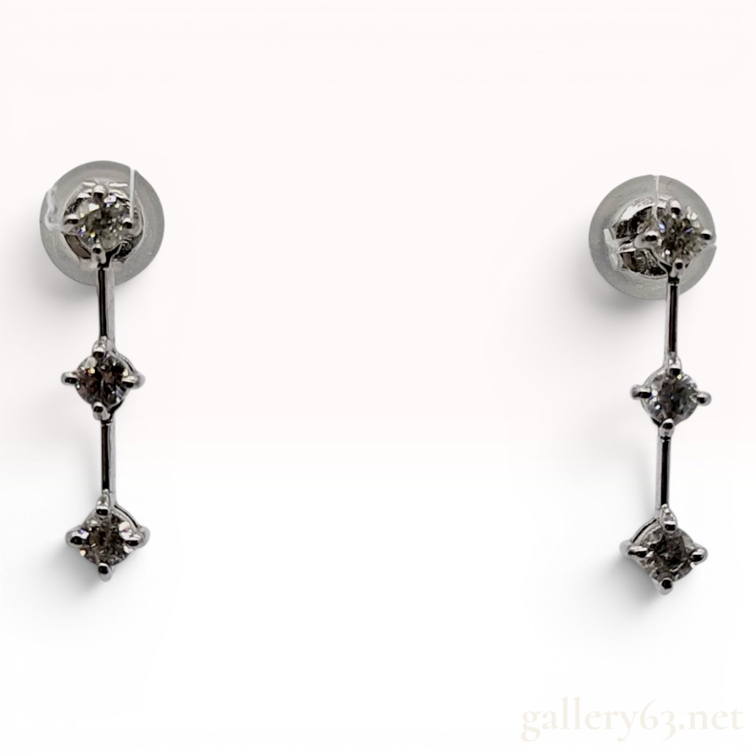 A Pair of 14 Karat White Gold and Diamond Three-Stone Drop Earrings