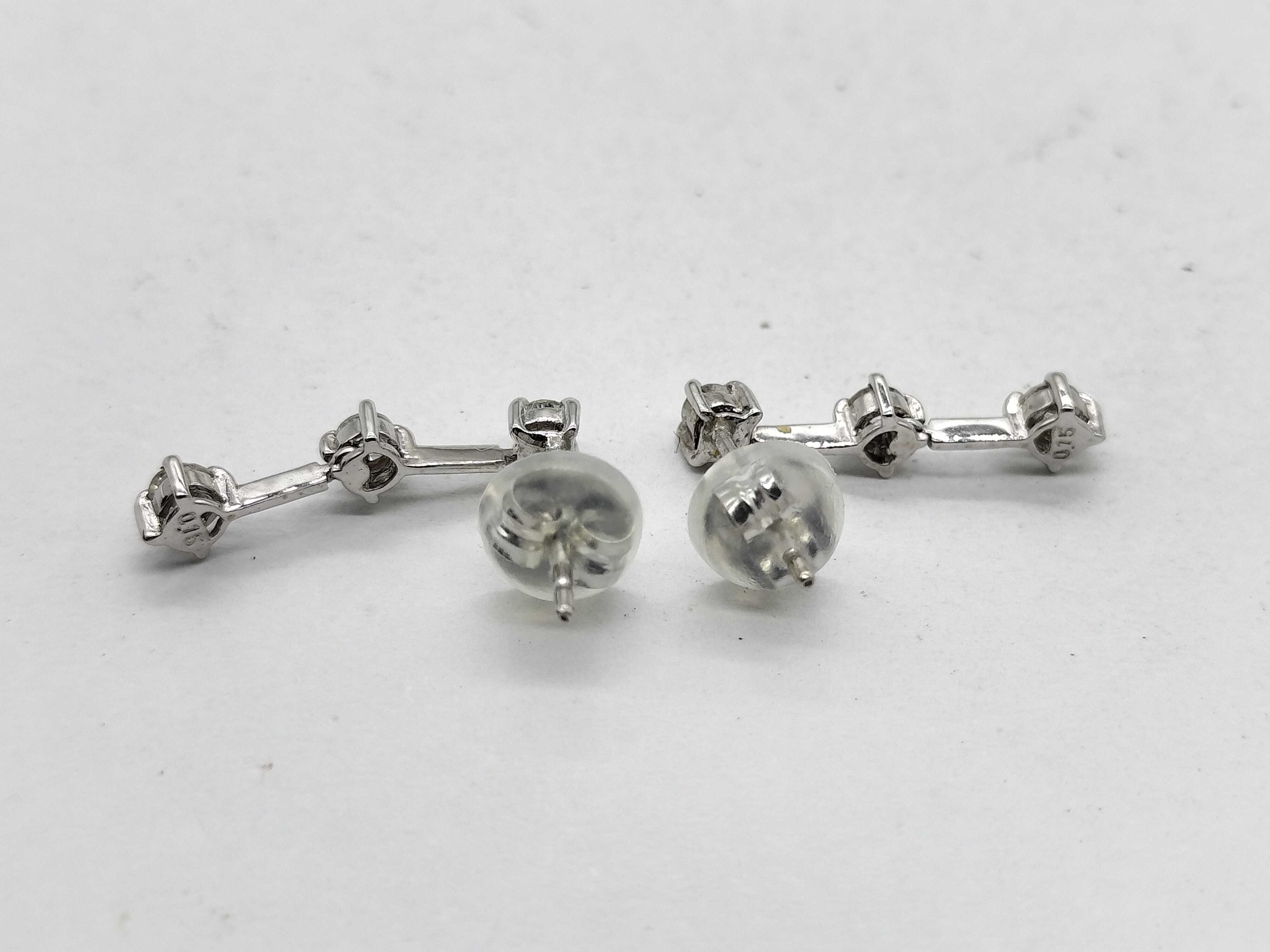 A Pair of 14 Karat White Gold and Diamond Three-Stone Drop Earrings