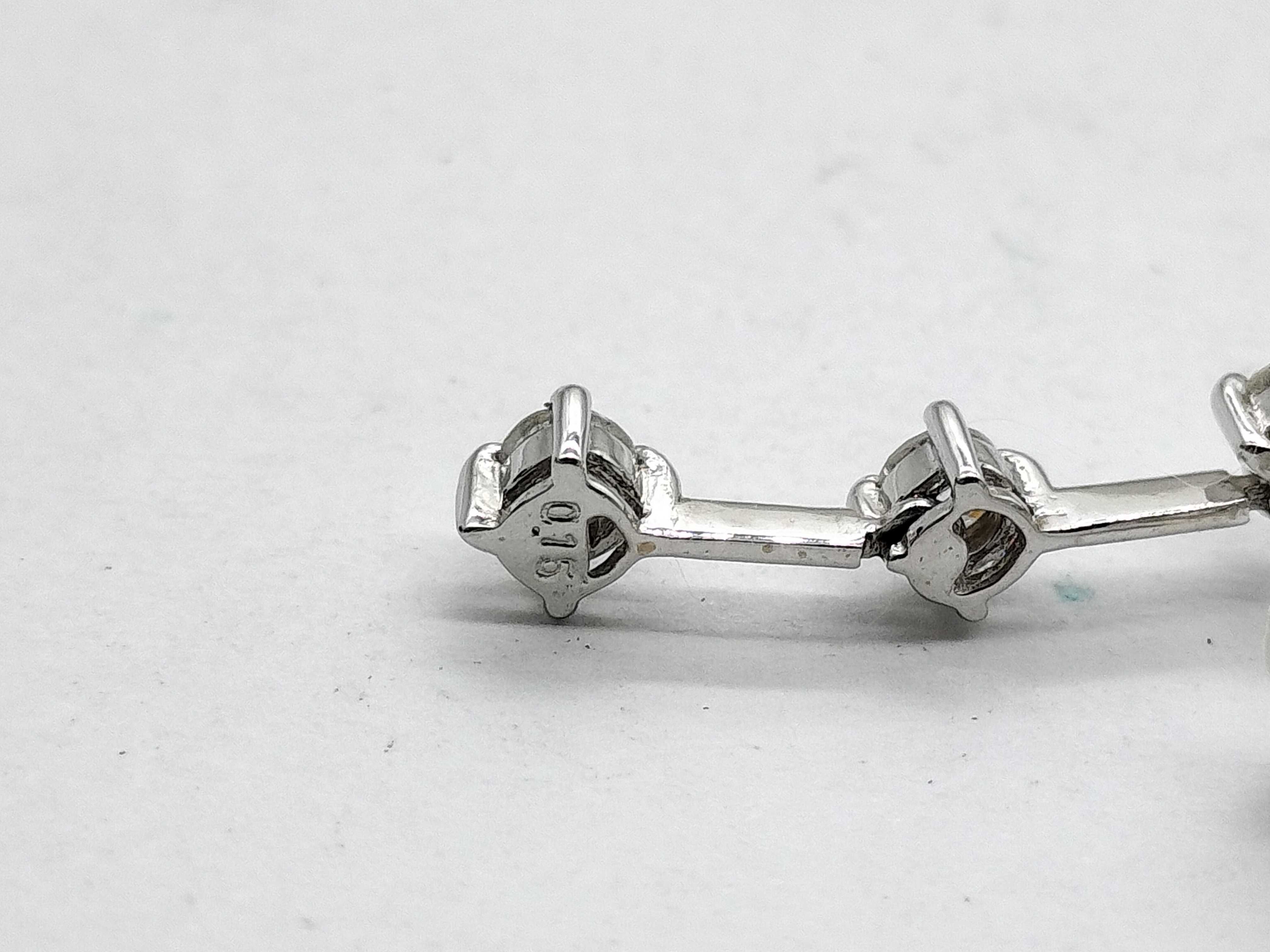 A Pair of 14 Karat White Gold and Diamond Three-Stone Drop Earrings