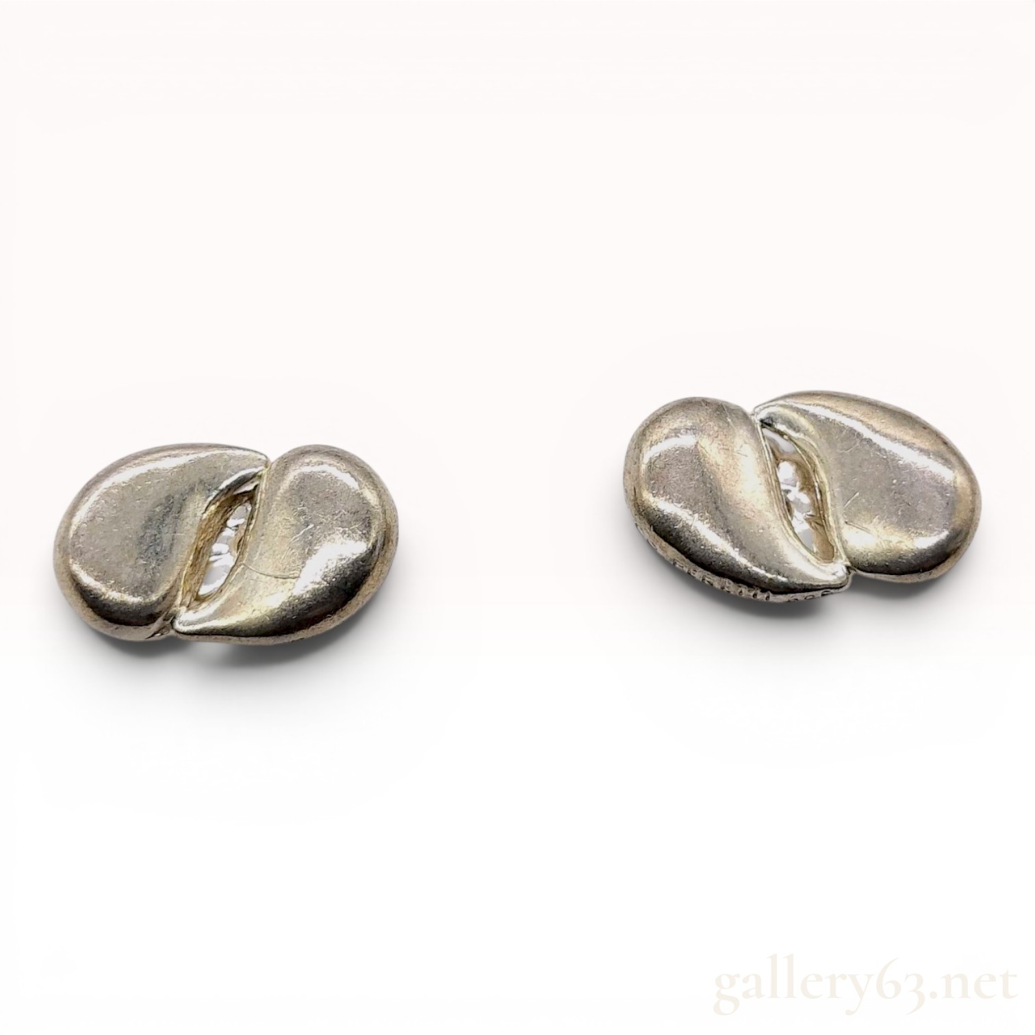 A Pair of Tiffany & Co. Elsa Peretti Sterling Silver Bean Stud Earrings