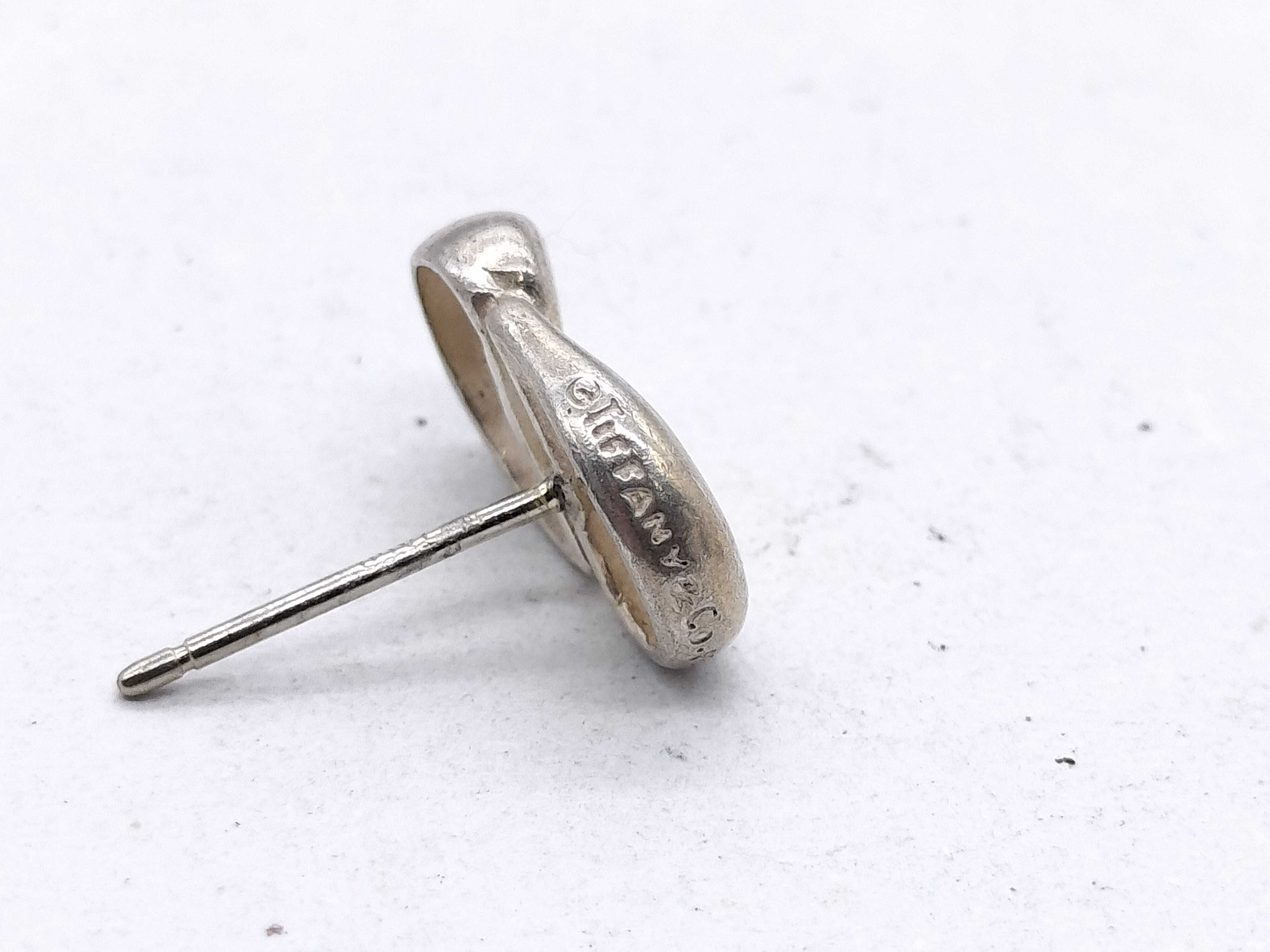 A Pair of Tiffany & Co. Elsa Peretti Sterling Silver Bean Stud Earrings