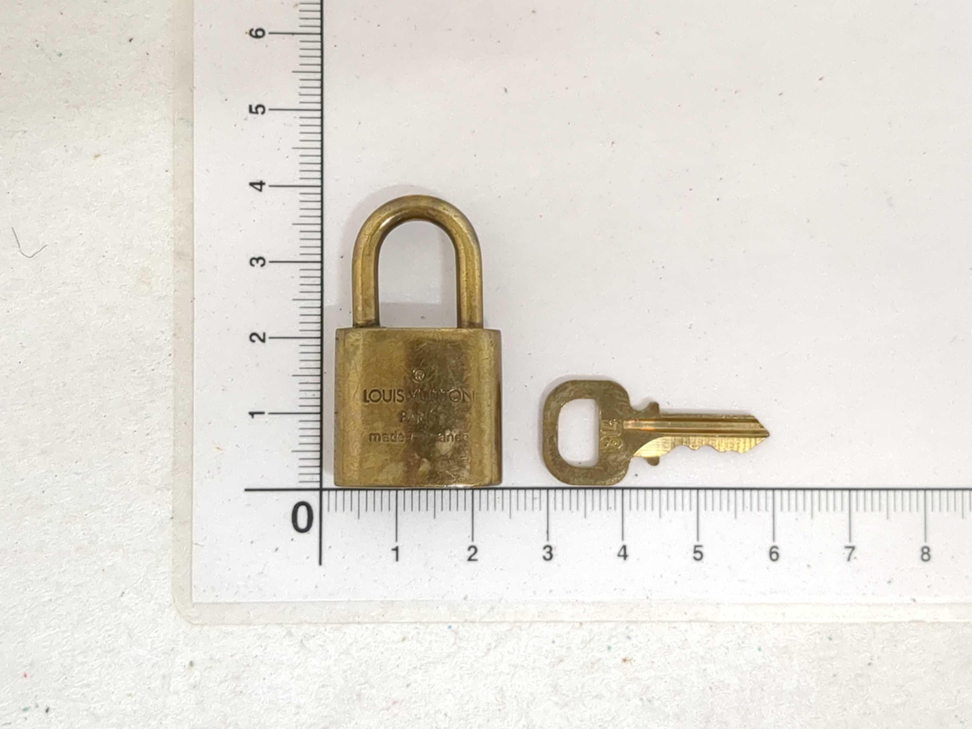 A Set of Four Louis Vuitton Brass Padlocks with Matching Keys