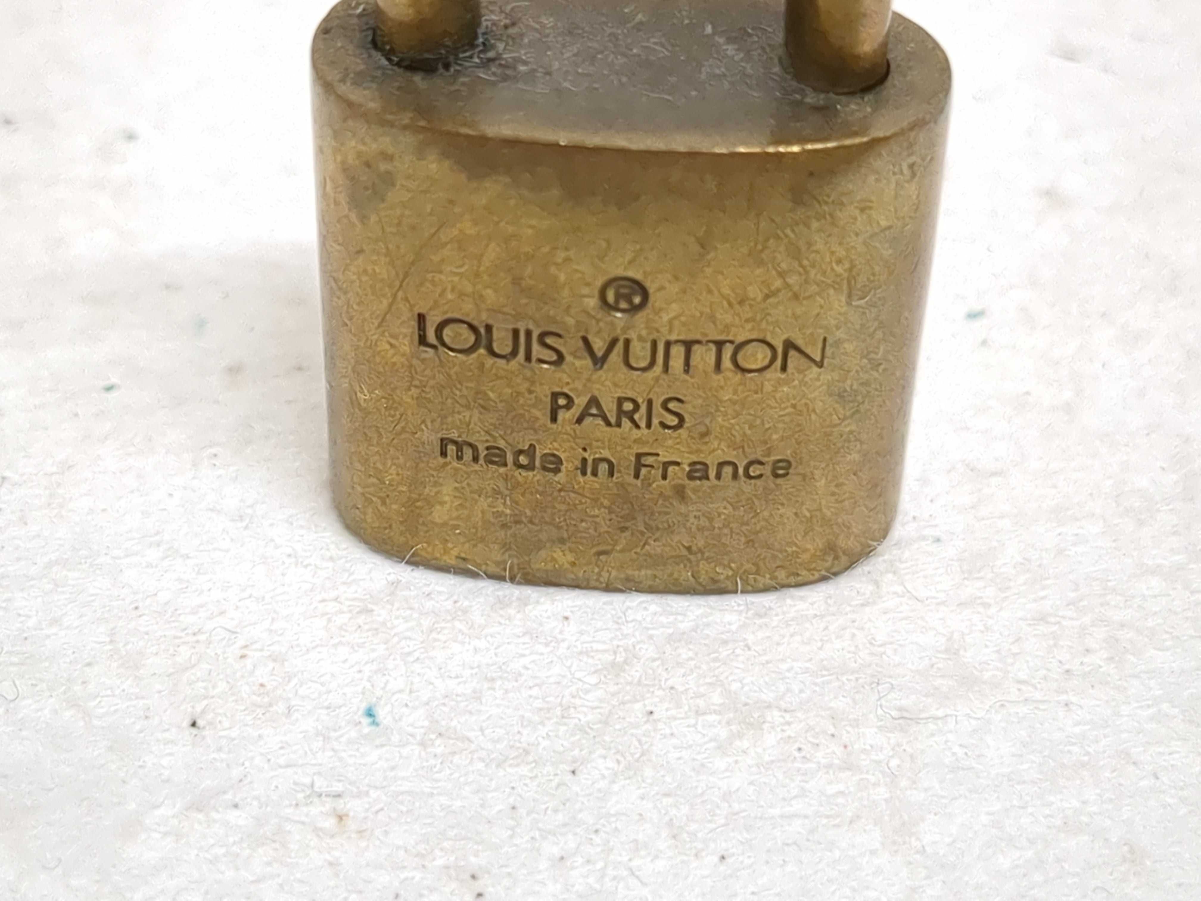 A Set of Four Louis Vuitton Brass Padlocks with Matching Keys