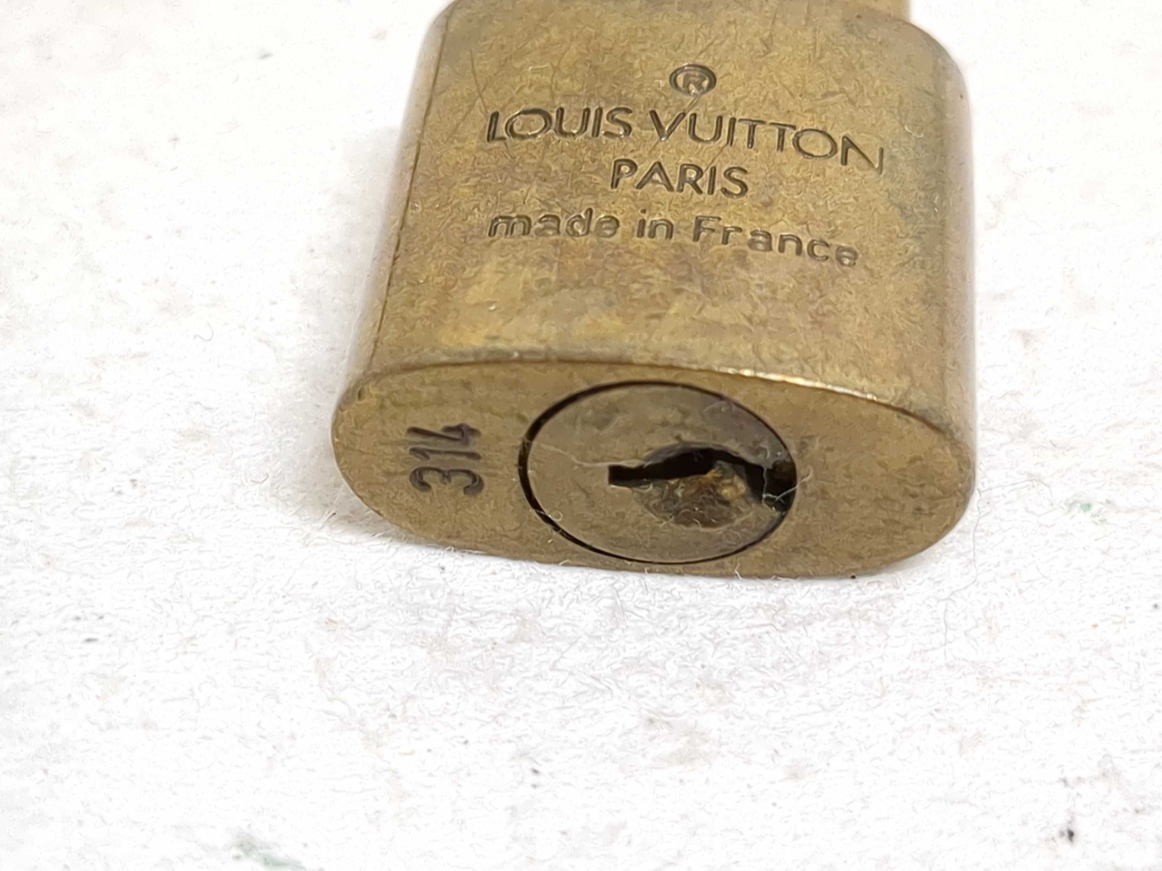 A Set of Four Louis Vuitton Brass Padlocks with Matching Keys