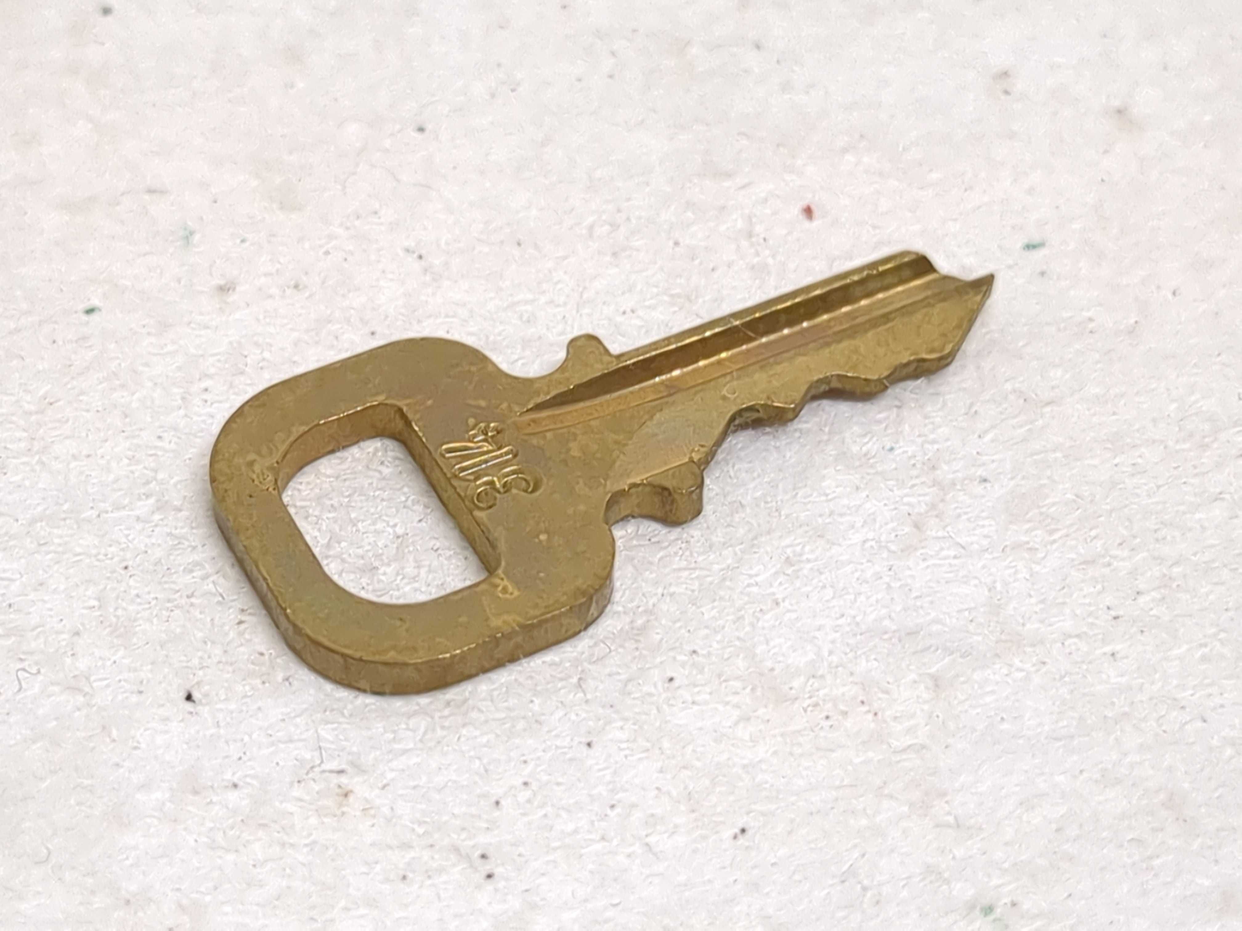 A Set of Four Louis Vuitton Brass Padlocks with Matching Keys