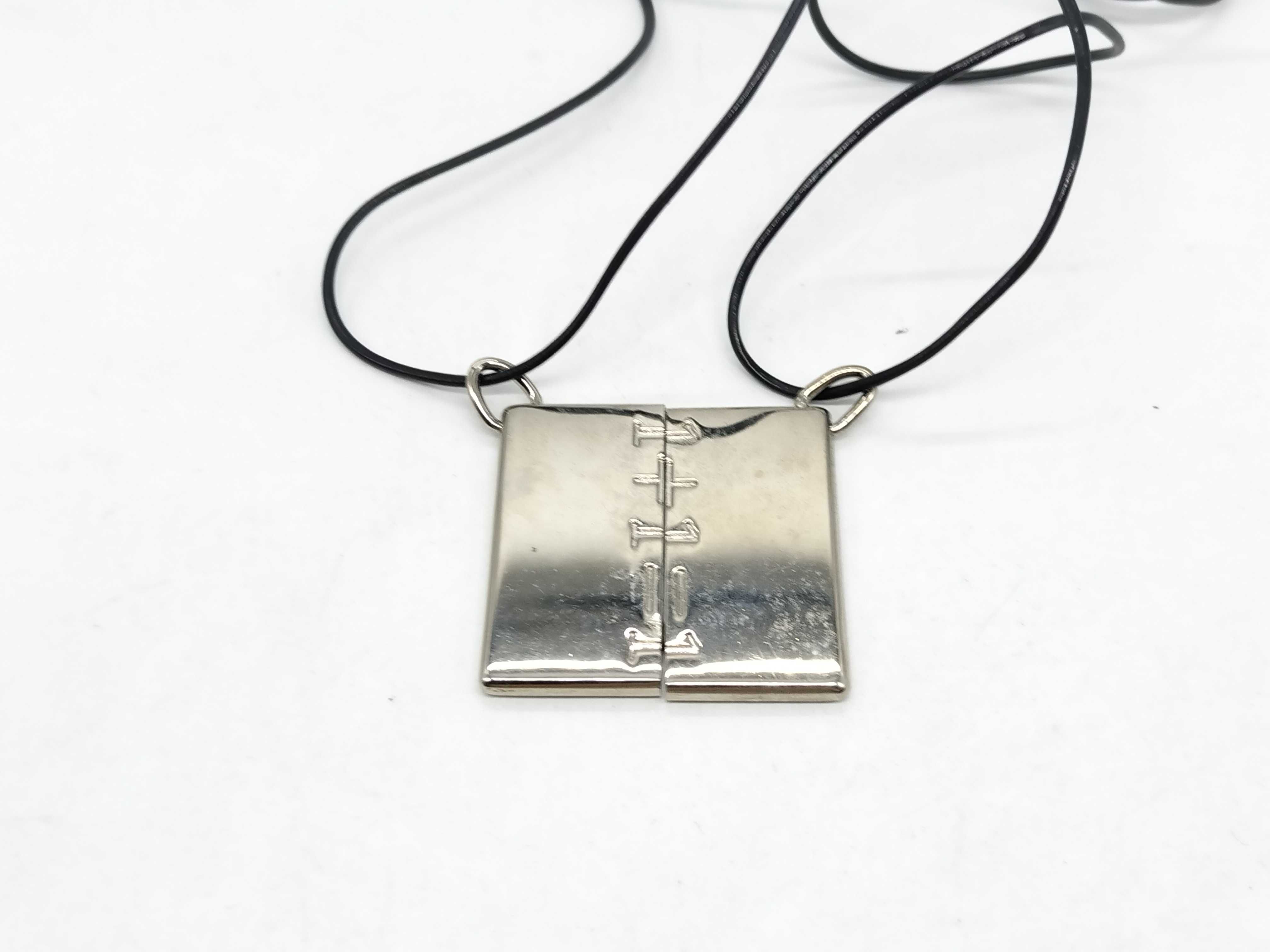 A Pair of Hermes Symbole 1+1=1 Interlocking Pendant Necklaces