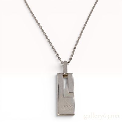 Gucci Sterling Silver G Plate Pendant Necklace. A sterling silver pendant necklace by the 