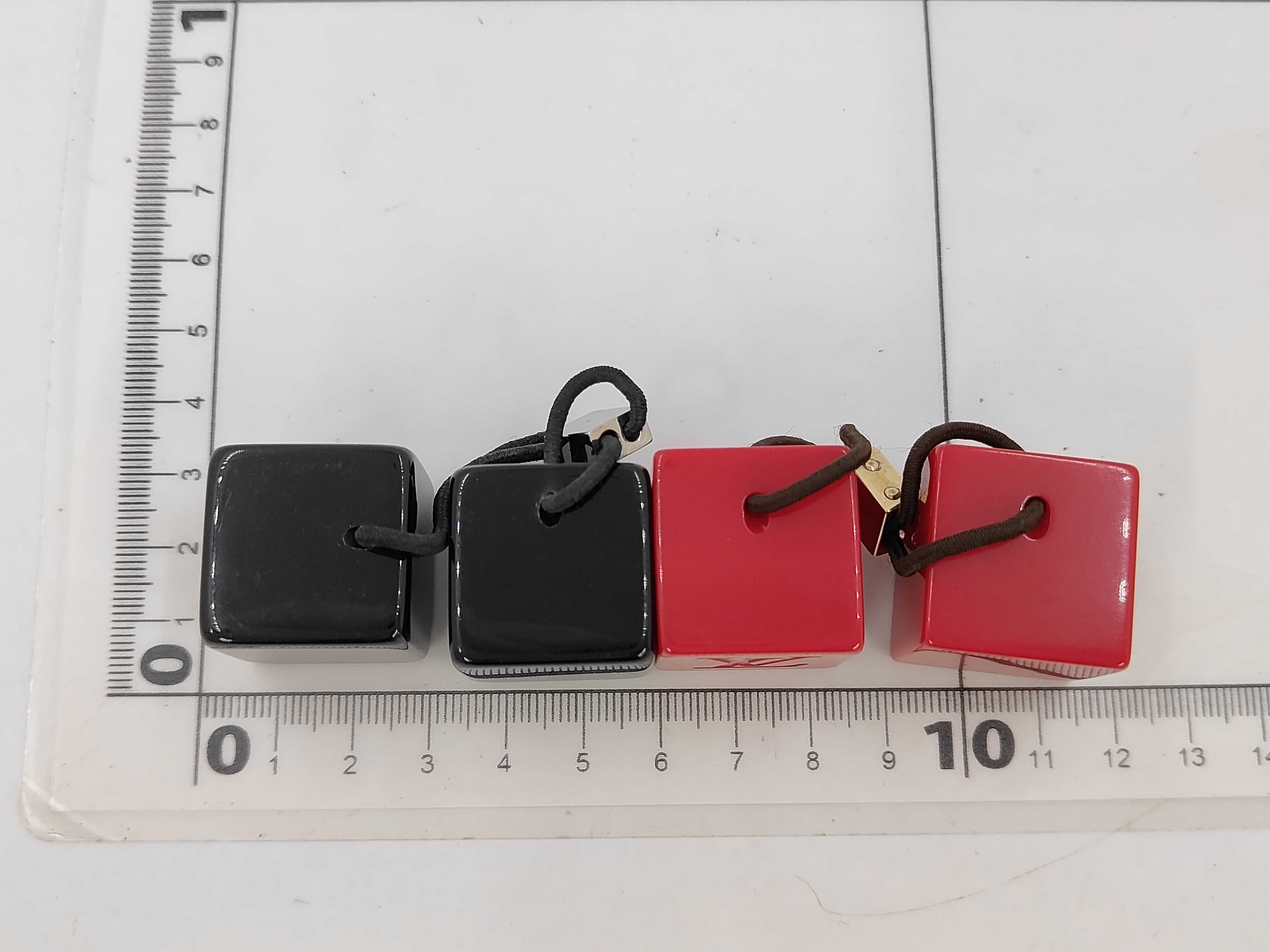 A Pair of Louis Vuitton Resin Hair Cube Elastics