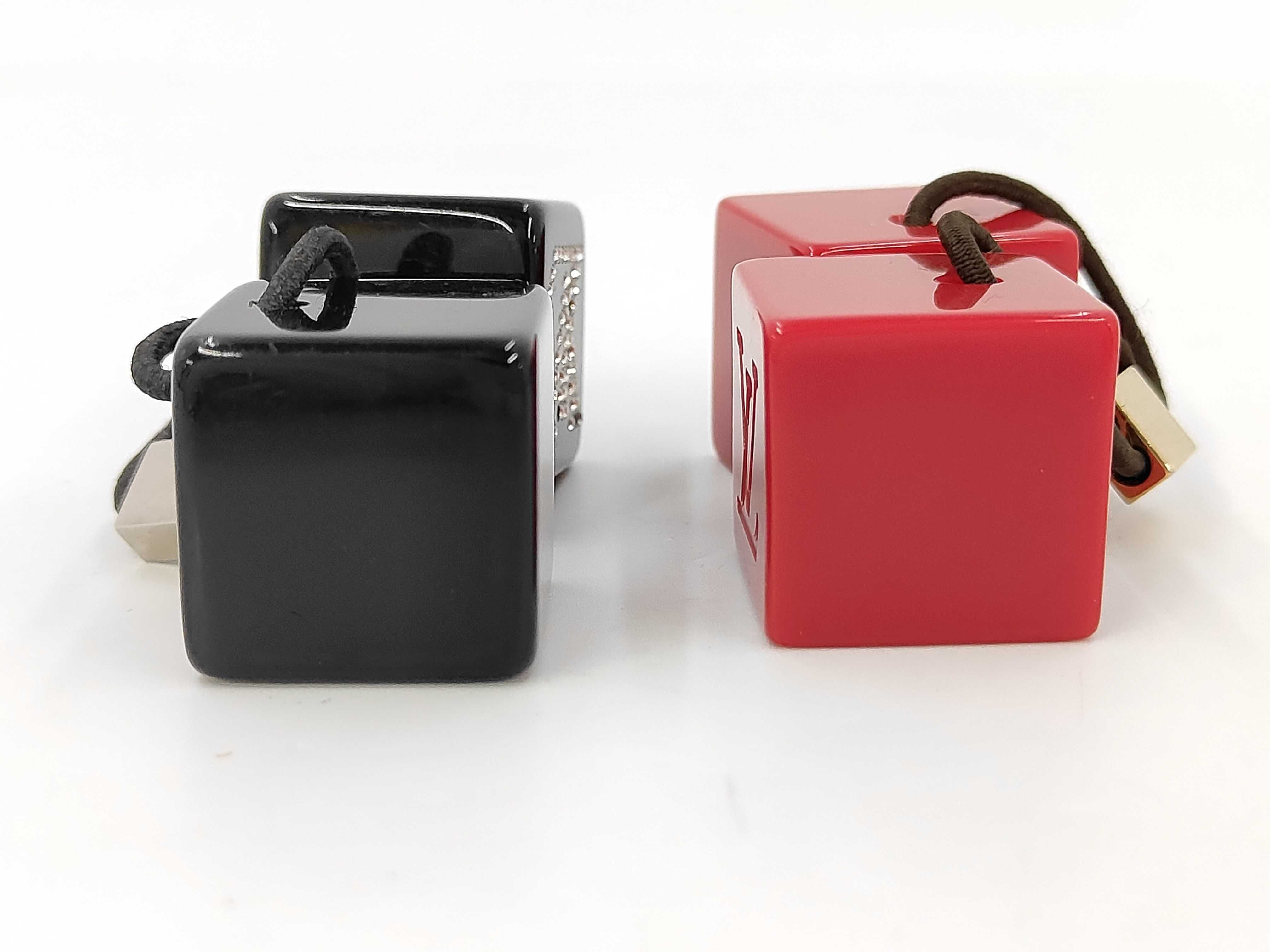 A Pair of Louis Vuitton Resin Hair Cube Elastics