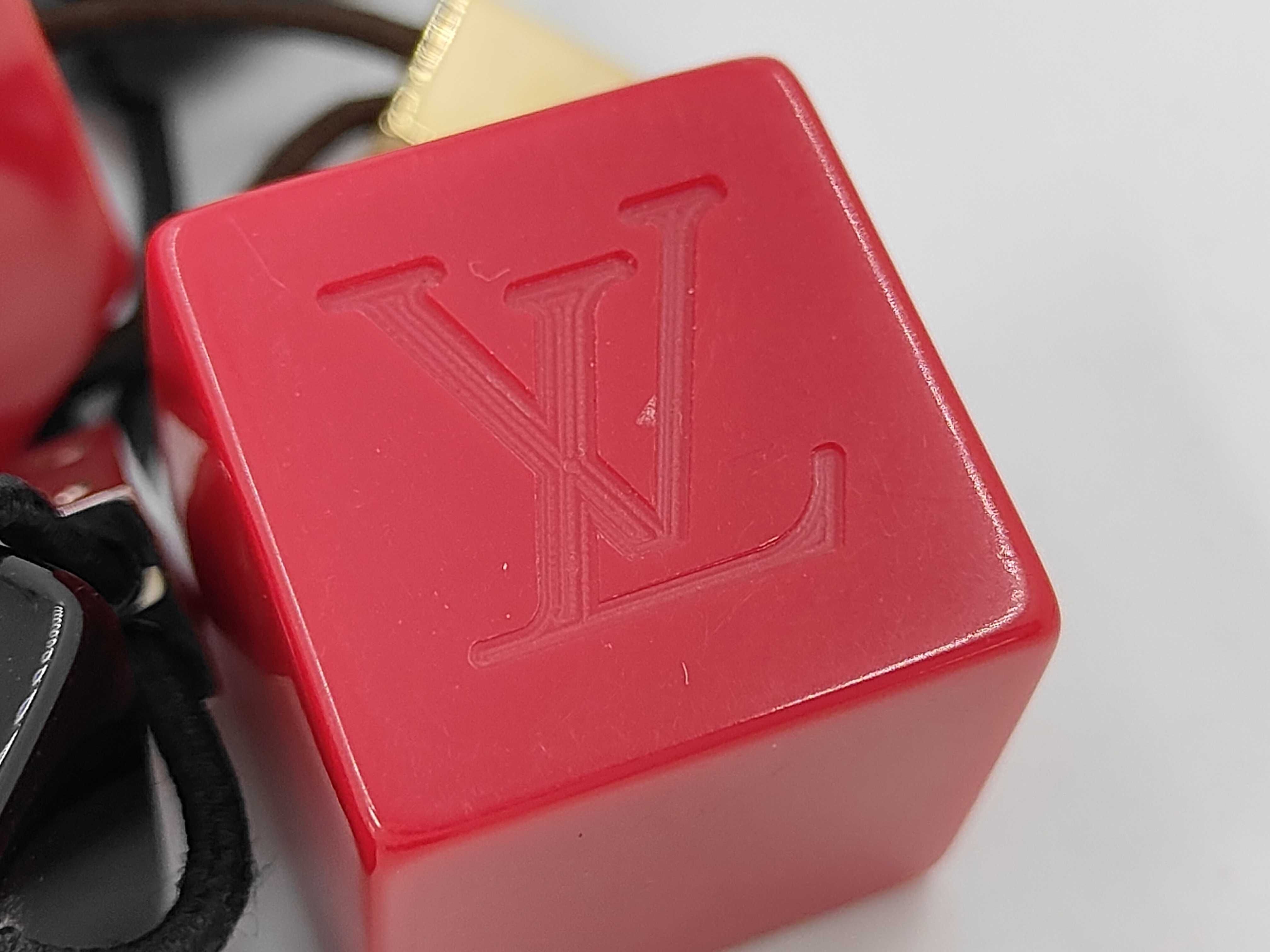 A Pair of Louis Vuitton Resin Hair Cube Elastics