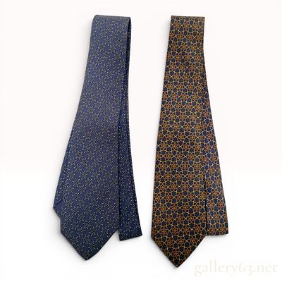 Two Hermes Paris Silk Neckties. This lot consists of two designer silk neckties from Hermes 