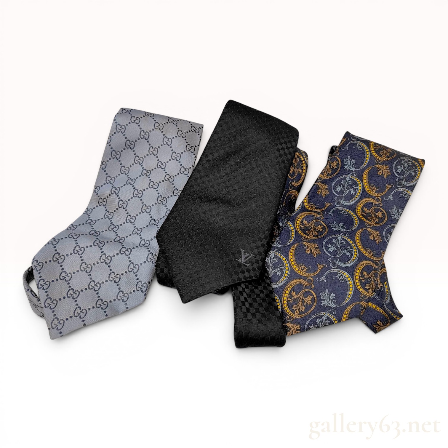 A Trio of Luxury Designer Silk Neckties Including Gucci, Louis Vuitton, and Christian Dior